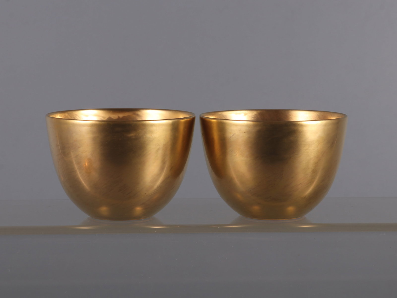 A Pair of Exquisite Gilt glaze Cup: A Pair of Exquisite Gilt glaze Cup Qing Dynasty, China Yongzheng Four-character Mark Size:2inx2.8in鎏金缸杯一对 中国清代 雍正