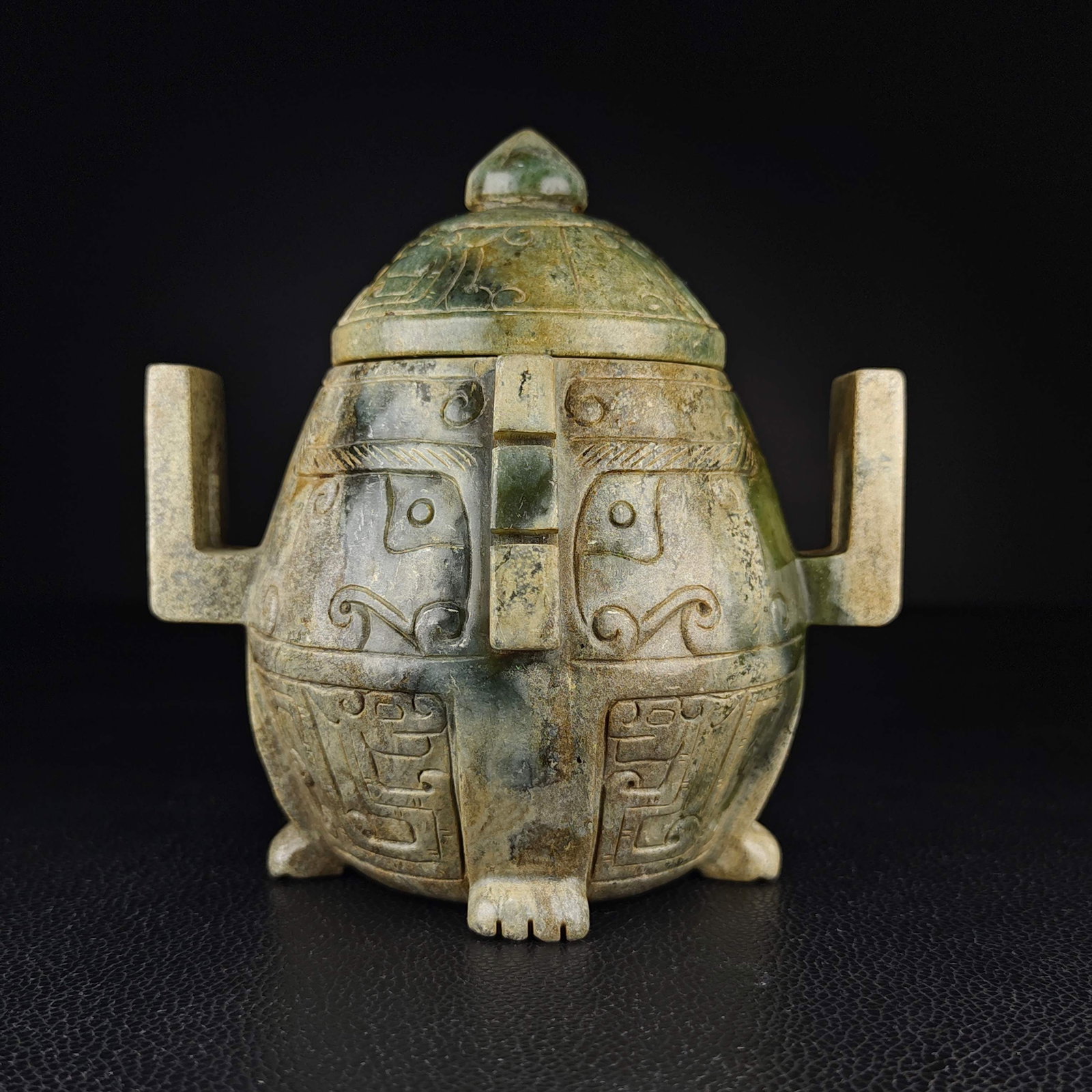 An Exquisite White Jade Beast-Face Pattern Double-Ears Censer: An Exquisite White Jade Beast-Face Pattern Double-Ears Censer Han Dynasty, China Size:5.1inx5.5in Weight:861g白玉双耳盖鼎 中国汉代