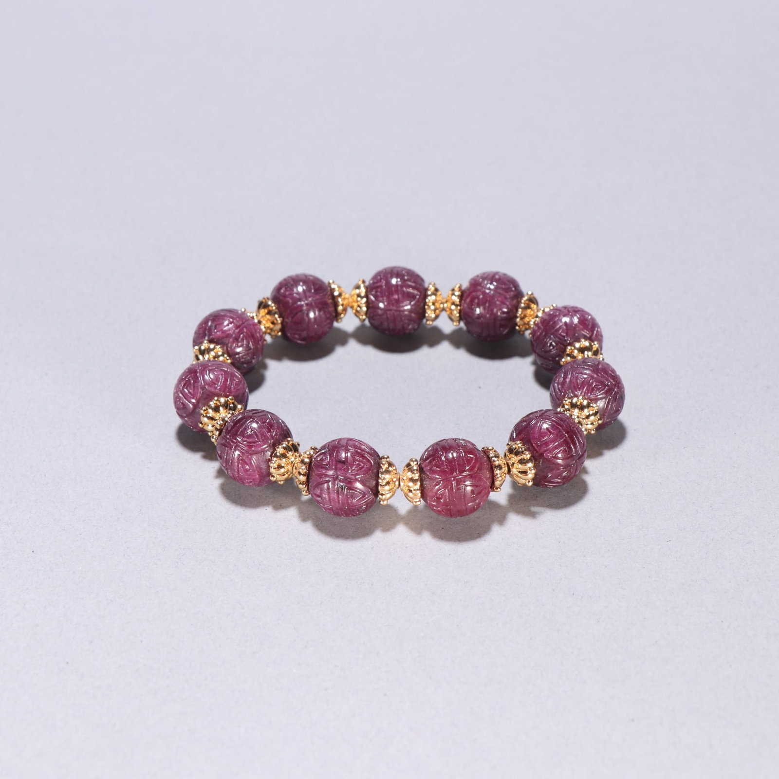 An Exquisite Red Gems Bracelets: An Exquisite Red Gems Bracelets Qing Dynasty, China Size:0.5in Weight:51.9g红宝石雕团寿纹手串 中国清代 Size:1.3cm Weight:5