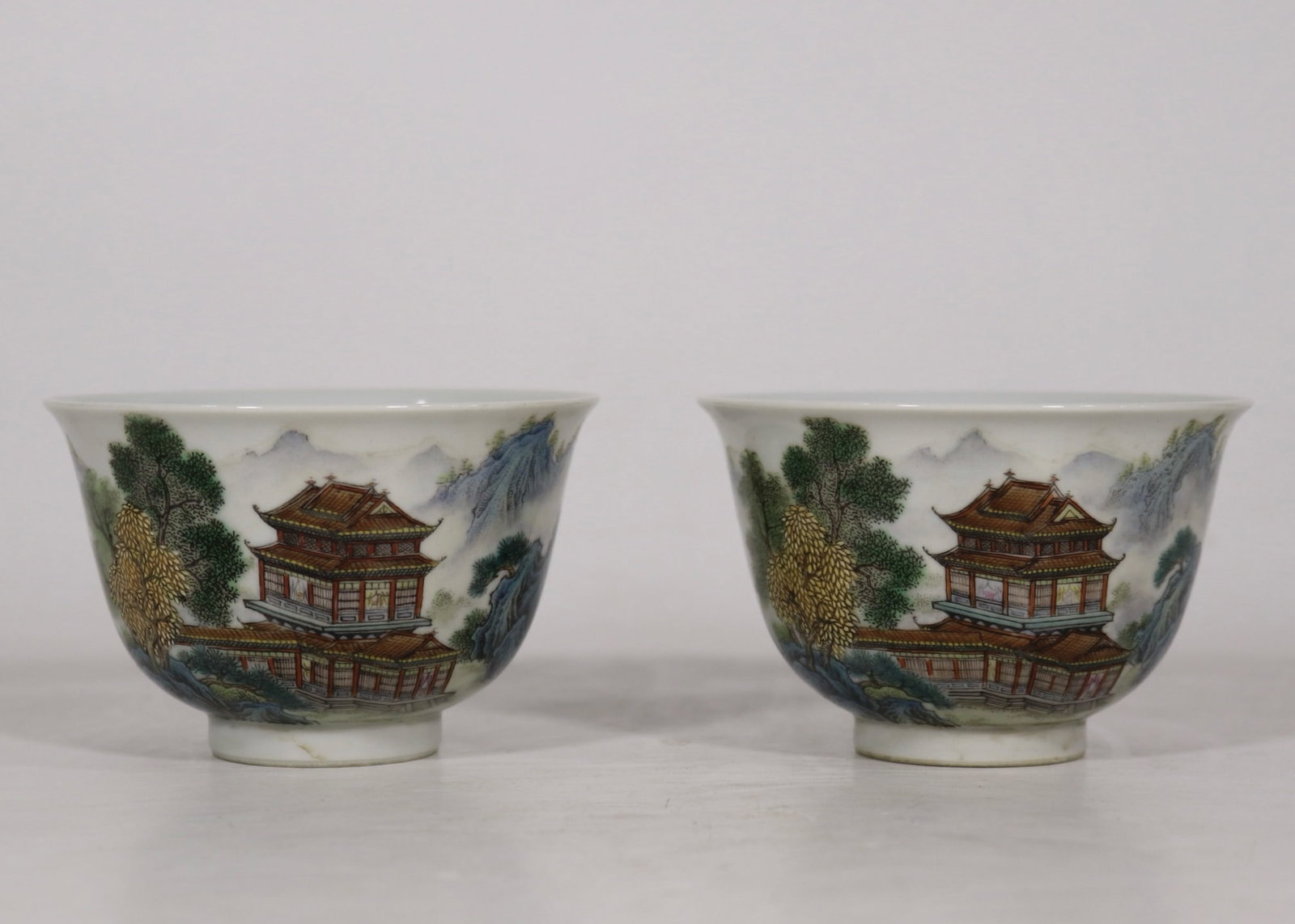 An Exquisite Enamel Landscape Pattern Cup: An Exquisite Enamel Landscape Pattern Cup Qing Dynasty, China Qianlong Four-character Mark Size:2.4inx3.6in珐琅彩山水楼阁对杯 中国
