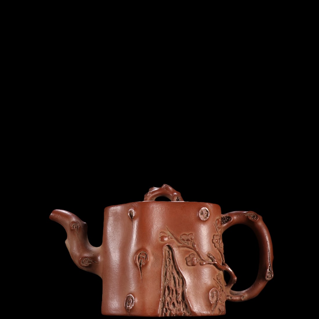 An Exquisite Purple Sands Flower Pattern Teapot: An Exquisite Purple Sands Flower Pattern Teapot Wu yun gen Size:4.2inx7.4in紫砂梅桩壶 吴雲根 Size:10.6cmx18.7cm
