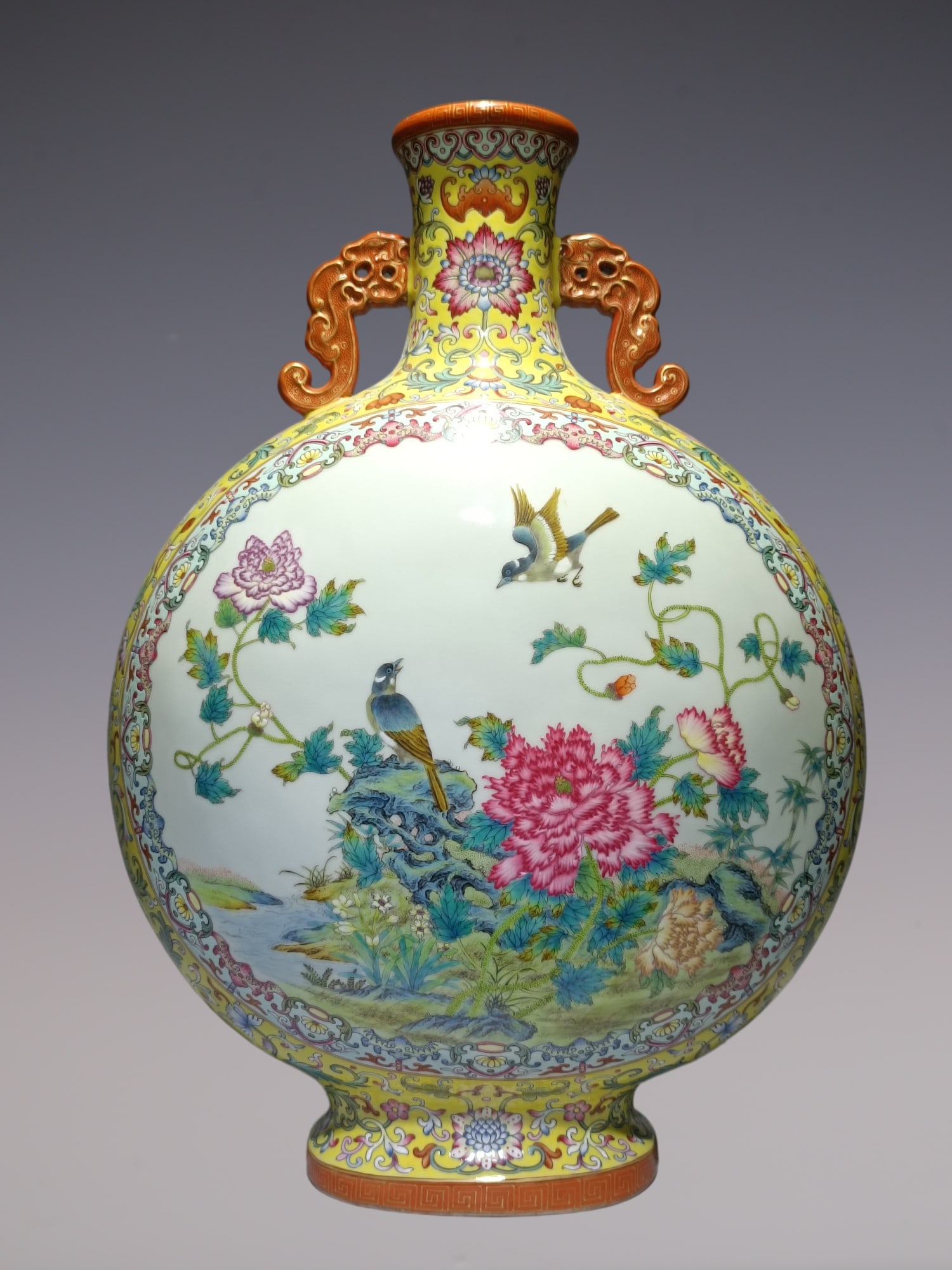 An Exquisite Famille-Rose Lotus Pattern Flower and Bird Pattern Double-Ears Vase: An Exquisite Famille-Rose Lotus Pattern Flower and Bird Pattern Double-Ears Vase Qing Dynasty, China Qianlong Six-character Mark Size:19.3inx13.8in粉彩黄地福运Ű