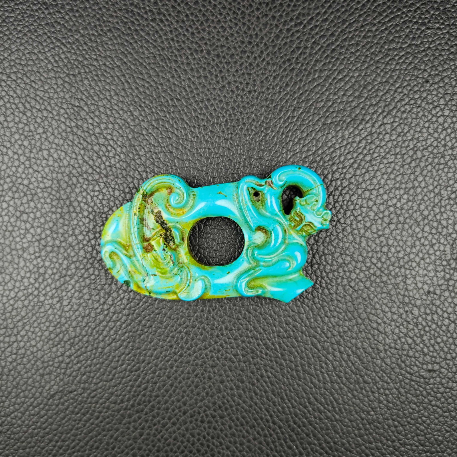 An Exquisite Turquoise Beast-Face Pattern Pendant: An Exquisite Turquoise Beast-Face Pattern Pendant the Warring States period in China Size:1.4inx2.4in Weight:29g绿松石兽面挂件 战国时期
