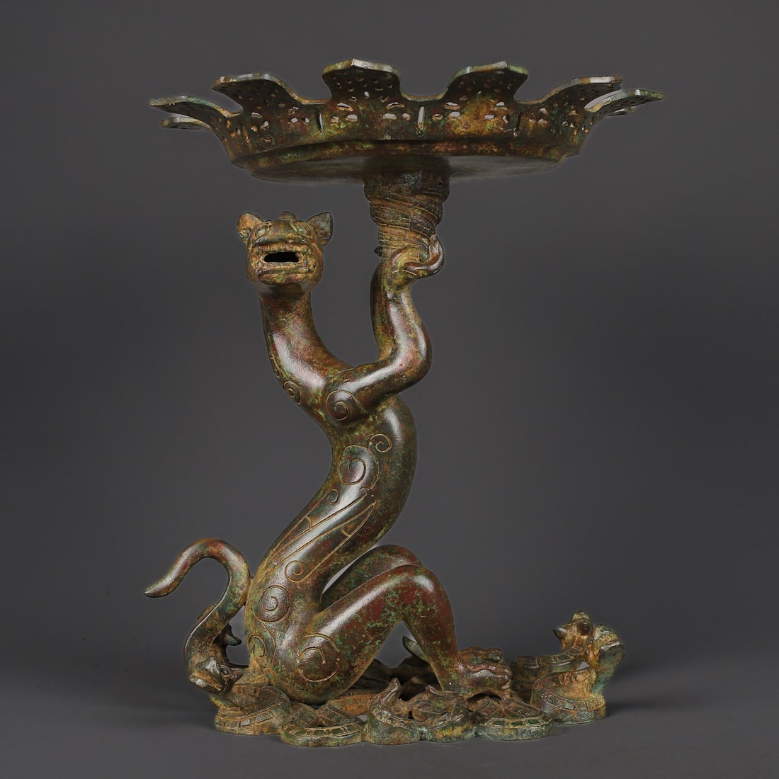 An Exquisite Bronze With Inscription Auspicious Beast-Shaped Plate: An Exquisite Bronze With Inscription Auspicious Beast-Shaped Plate Han Dynasty, China Size:10.2inx11.8in Weight:3460g青铜龙灯盘 中国汉代 Size:26cm
