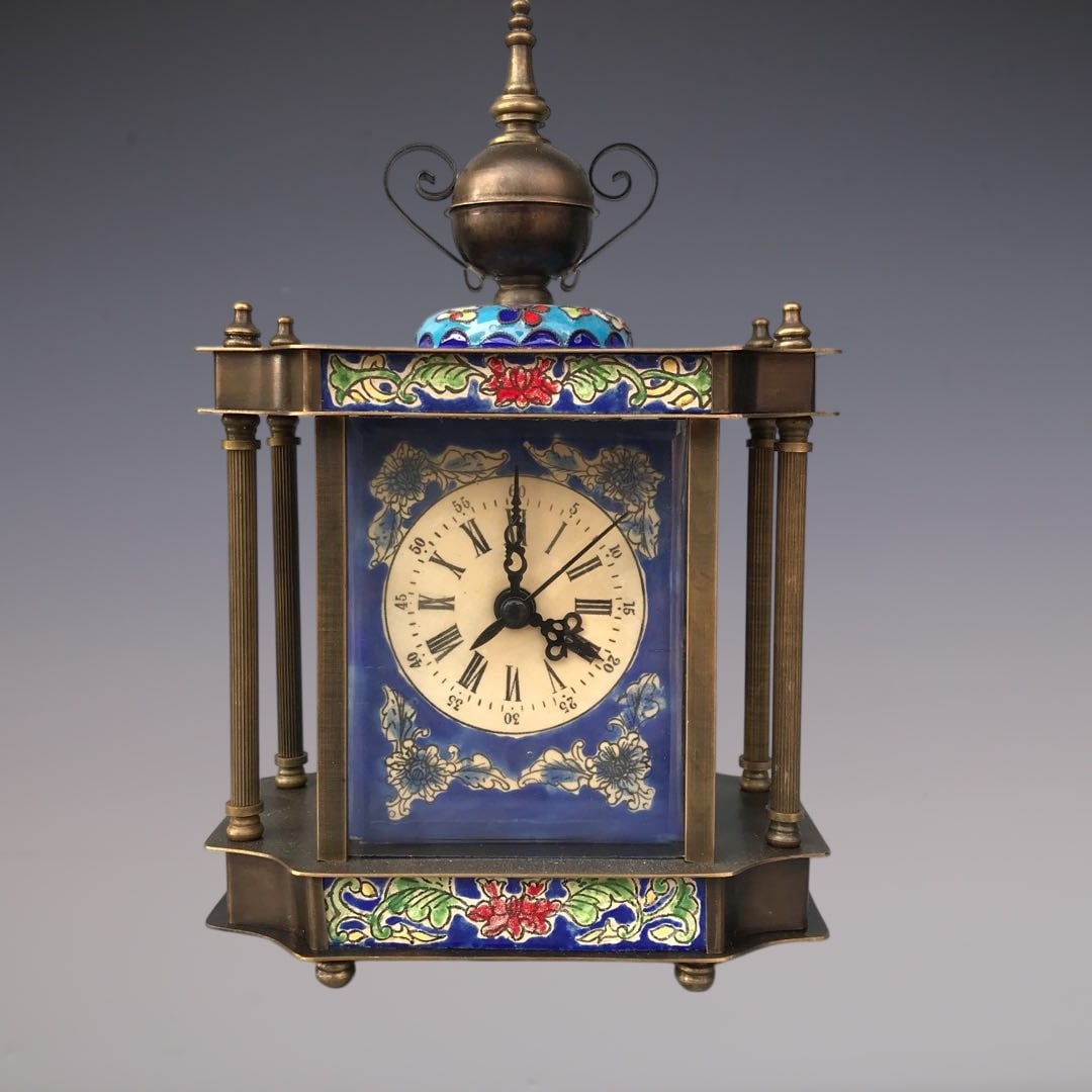 An Exquisite Bronze Lotus Pattern Clock: An Exquisite Bronze Lotus Pattern Clock Qing Dynasty, China Size:5.9inx3.1inx7.9in铜缠枝莲纹钟表 中国清代 Size:15cmx8cmx20cm