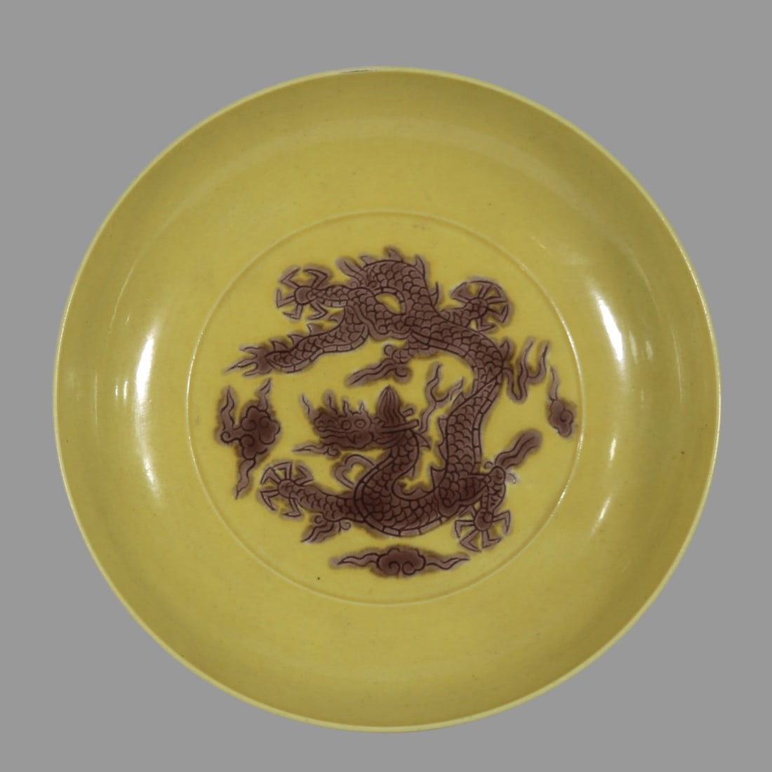 A Exquisite Yellow Glazed Dragon Pattern Plate: A Exquisite Yellow Glazed Dragon Pattern Plate,Ming Dynasty, China,Zhengde Four-character Mark,Size:5.8in 黄釉龙纹盘,中国明代,正德