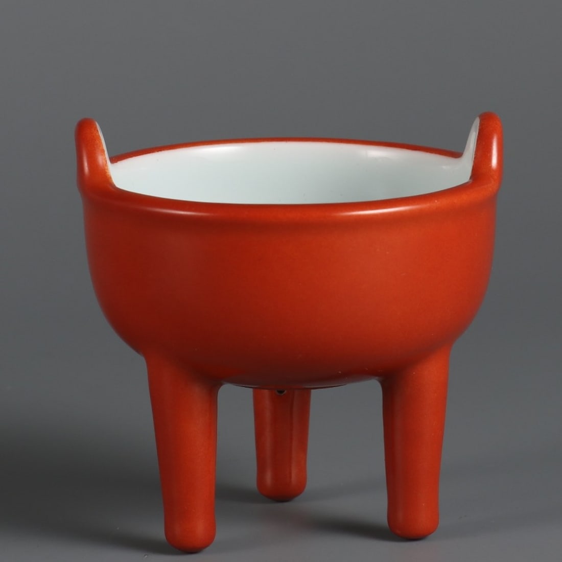 A Exquisite Coral Red Glazed Tripod Censer: A Exquisite Coral Red Glazed Tripod Censer,Qing Dynasty, China,Qianlong Four-character Mark,Size:2.8inx2.7in