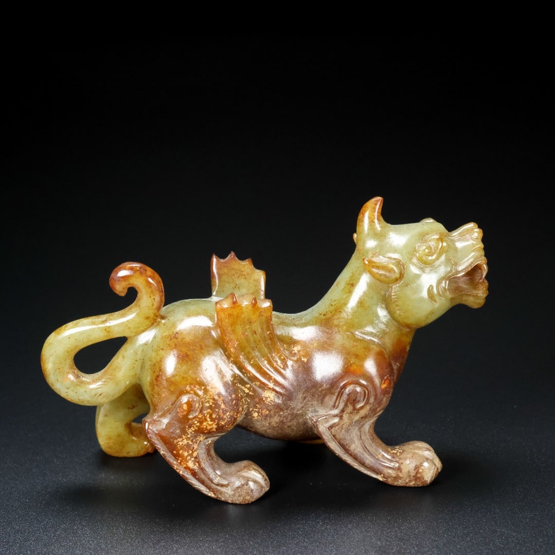 A Exquisite Hotan Jade Auspicious Beast Ornament: A Exquisite Hotan Jade Auspicious Beast Ornament,Hang Dynasty, China,Size:3.5inx1.2inx2in,Weight:136g 和田玉瑞兽摆件,中国汉代