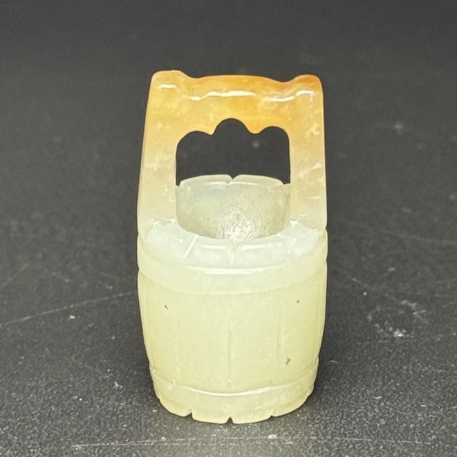 A Exquisite Hotan Jade Bucket-shaped Ornament: A Exquisite Hotan Jade Bucket-shaped Ornament,Qing Dynasty, China,Size:1.3inx0.7inx0.7in,Weight:13g 和田玉木桶摆件,中国清代