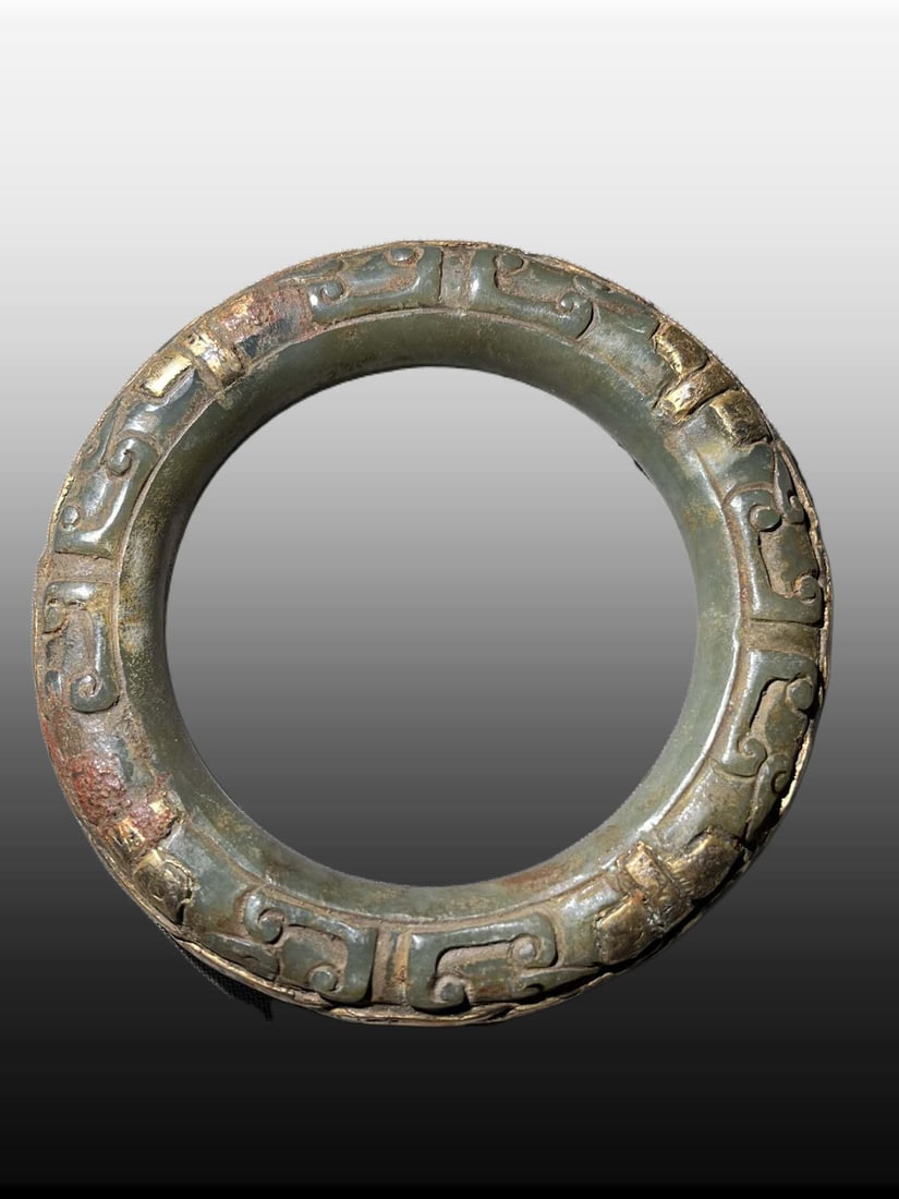 A Exquisite Hetian Jade Gilt Bracelets: A Exquisite Hetian Jade Gilt Bracelets,Han Dynasty, China,Size:3.6inx2.4inx0.5in,Weight:123.8g 和田玉鎏金镯子,中国汉代