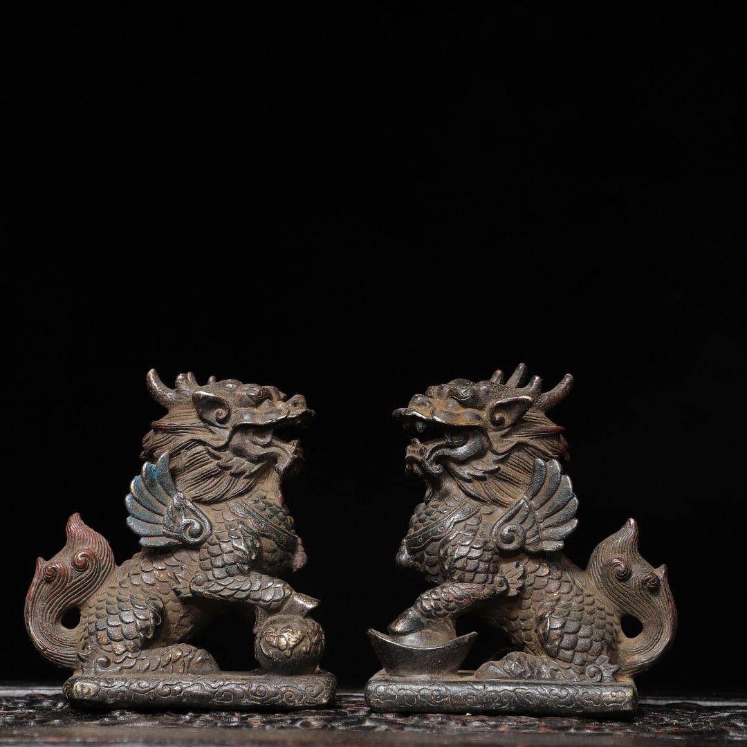 A pair of Exquisite Gold-Foiled Bronze Kylin Ornaments: A pair of Exquisite Gold-Foiled Bronze Kylin Ornaments,Qing Dynasty, China,Qianlong Four-character Mark,Size:4.7inx4.3inx2.4in,Weight:1750g 一对铜拓金麒麟
