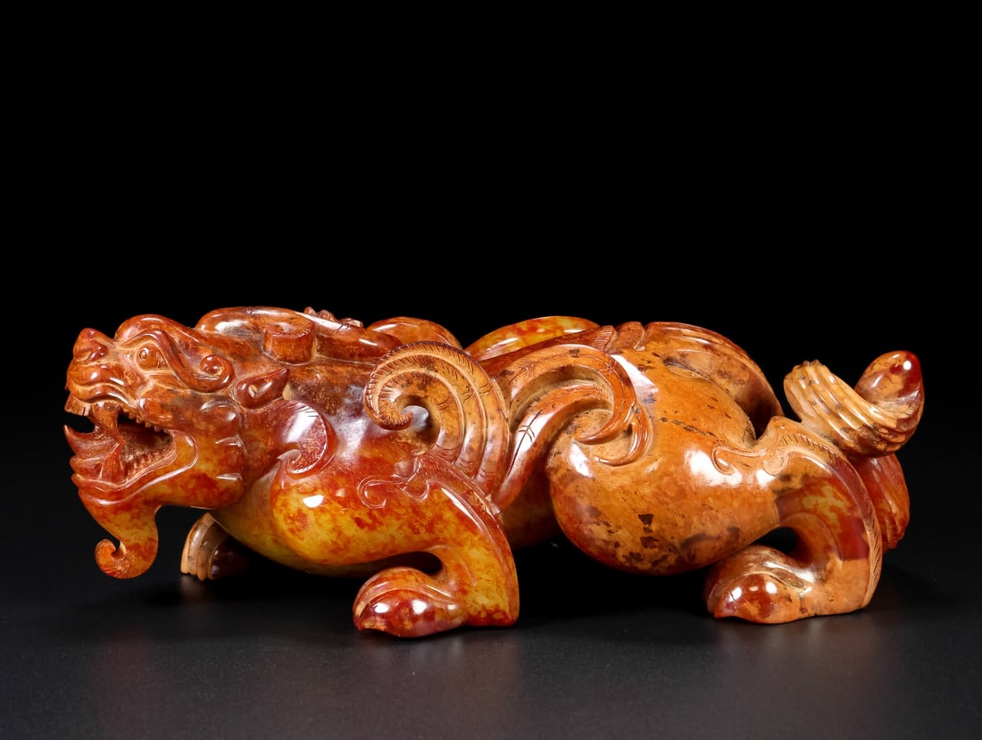 A Exquisite Hotan Jade Auspicious Beast Ornament: A Exquisite Hotan Jade Auspicious Beast Ornament,Hang Dynasty, China,Size:7.7inx3.5inx2.8in,Weight:1374g 和田玉瑞兽摆件,中国汉代