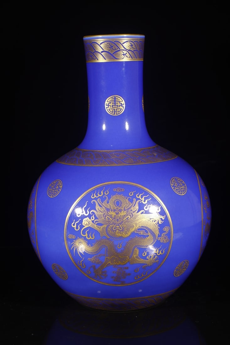 A Exquisite Ji Blue Glazed Painted Gold Dragon Pattern Vase: A Exquisite Ji Blue Glazed Painted Gold Dragon Pattern Vase,Qing Dynasty, China,Qianlong Six-character Mark,Size:21.7inx4.9inx7.5in 霁蓝釉描金龙纹瓶,