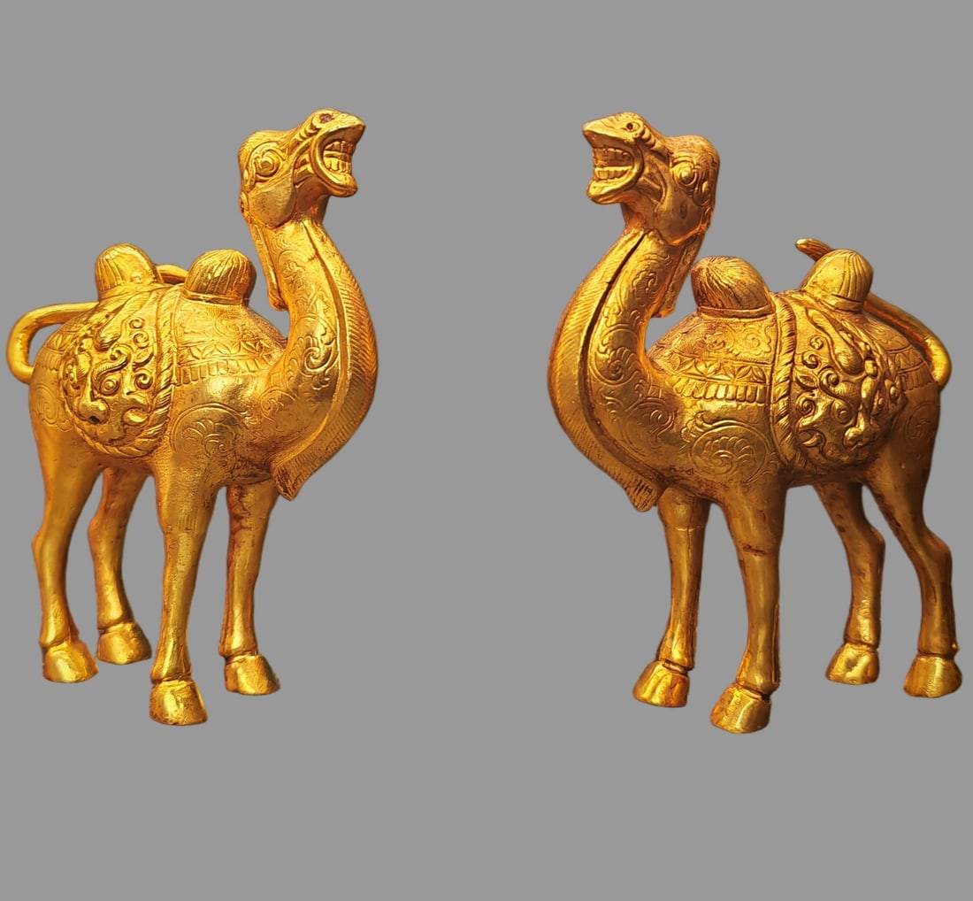 A pair of Exquisite Gilt Bronze Camel Ornament: A pair of Exquisite Gilt Bronze Camel Ornament,Tang Dynasty, China,Zhenguan Four-character Mark,Size:4.3inx3.9in