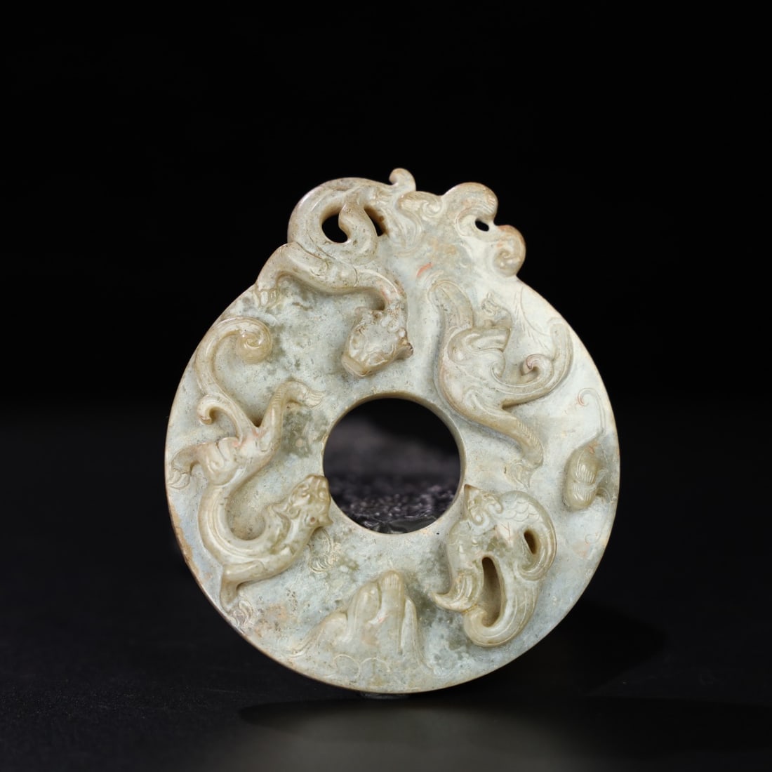 A Exquisite Hotan Jade Dragon Pattern Bi: A Exquisite Hotan Jade Dragon Pattern Bi,Han Dynasty, China,Size:3.9inx3.4inx0.7in,Weight:154g 和田玉龙玉璧,中国汉代