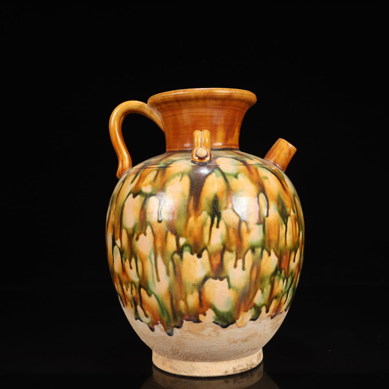 A Rare Tang Tri-Color Glazed Pottery Ewer: A Rare Tang Tri-Color Glazed Pottery Ewer,Tang Dynasty, China,Chinese Tang Tri-colored Pottery, or Tang Sancai, flourished during the Tang Dynasty (618–907 AD). It's renowned for its vibrant amb