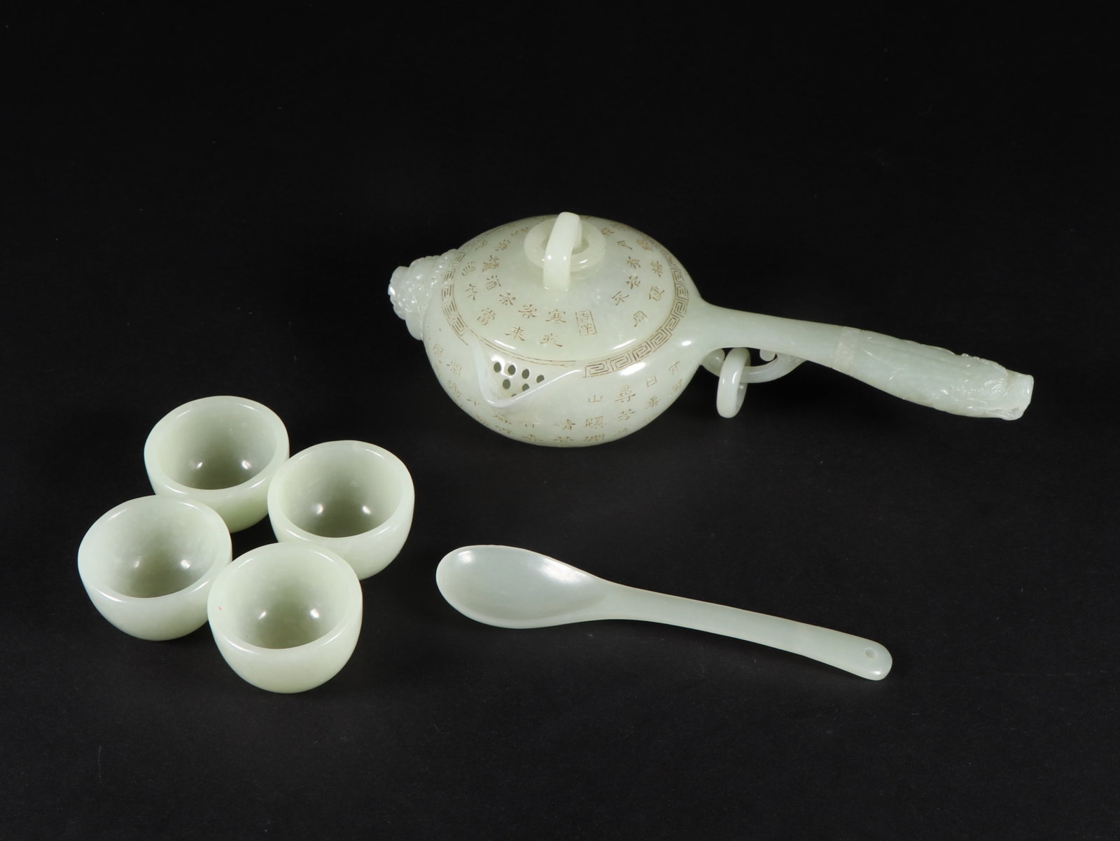 A Set of Fine White Jade Poem Pot,with Four Cups and Spoon: A Set of Fine White Jade Poem Pot,with Four Cups and Spoon,Qing Dynasty,China,With Mark,Size:(Pot)6.5inx3.2inx2.1in,(Cup)1.4inx0.9in,(Spoon)4.3in,Weight:270g 一套白玉诗&#