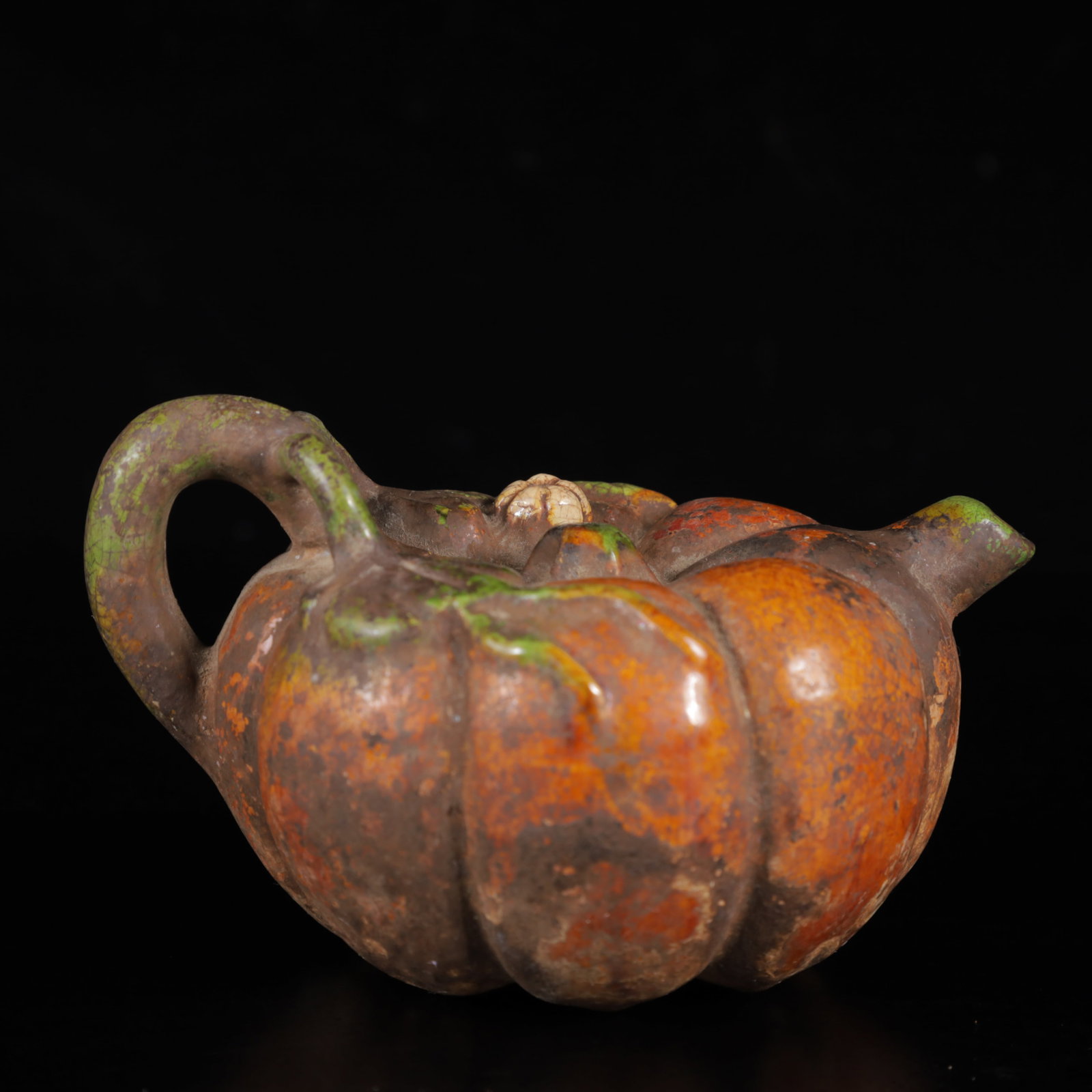 An Exquisite Tang Tri-Color Glazed Pottery Pumpkin-Shaped Teapot: An Exquisite Tang Tri-Color Glazed Pottery Pumpkin-Shaped Teapot,Tang Dynasty,China,Size:4.3inx3.3inx2.8in,Weight:180g 唐三彩南瓜形茶壶,中国