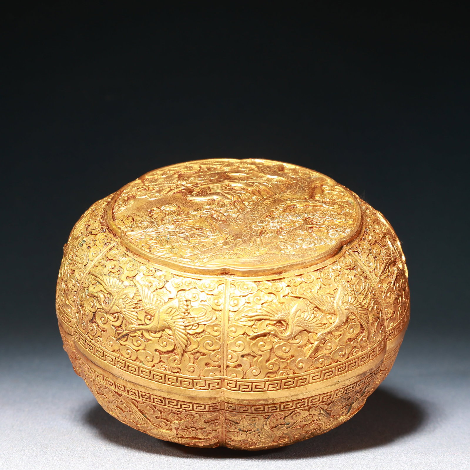 An Exquisite Gilt Bronze Auspicious Cloud,Pine and Crane Pattern Box with Cover: An Exquisite Gilt Bronze Auspicious Cloud,Pine and Crane Pattern Box with Cover,Qing Dynasty,China,Size:5.3inx3.3in,Weight:1250g 铜鎏金祥云松鹤纹盖