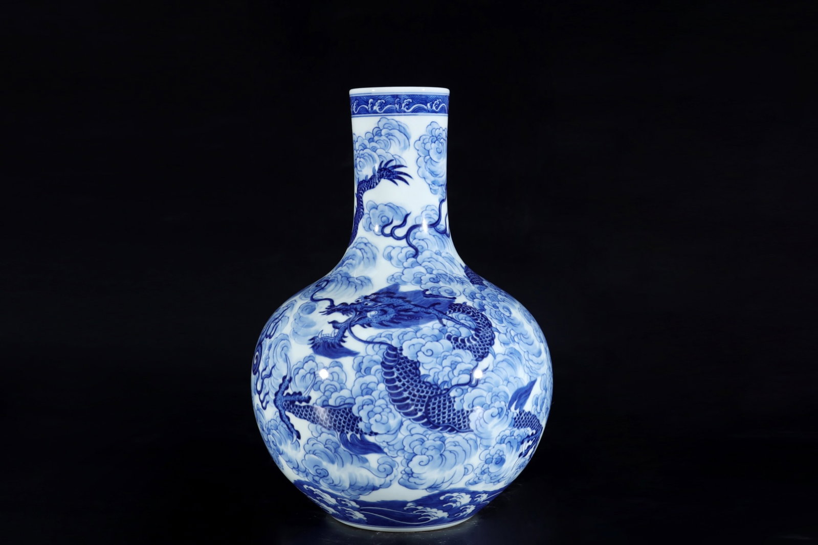 An Exquisite Blue and White Auspicious Cloud and Dragon Pattern Vase: An Exquisite Blue and White Auspicious Cloud and Dragon Pattern Vase,Qing Dynasty,China,Yongzheng Six-character Mark,Size:12.6inx8.9in