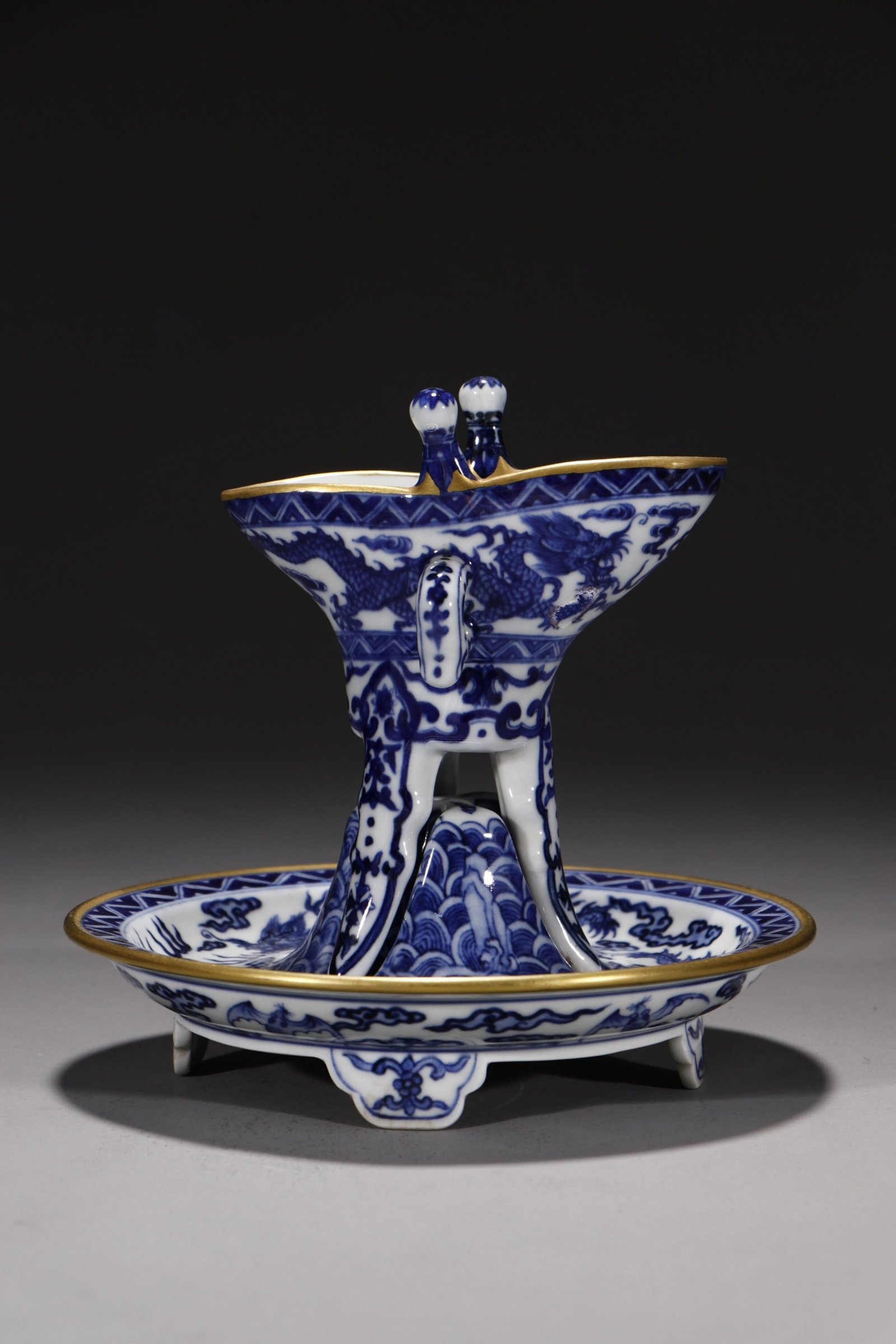 An Exquisite Blue and White Dragon Pattern Tripod Cup,with Base: An Exquisite Blue and White Dragon Pattern Tripod Cup,with Base,Qing Dynasty,China,Qianlong Four-character Mark,Size:6.7in 青花龙纹三足杯,带底
