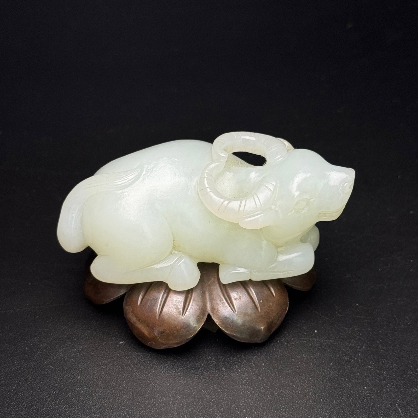 An Exquisite White Jade Buffalo Ornament: An Exquisite White Jade Buffalo Ornament,Qing Dynasty,China,Size:2.9inx1.5inx1.1in,Weight:111g 白玉牛摆件,中国清代