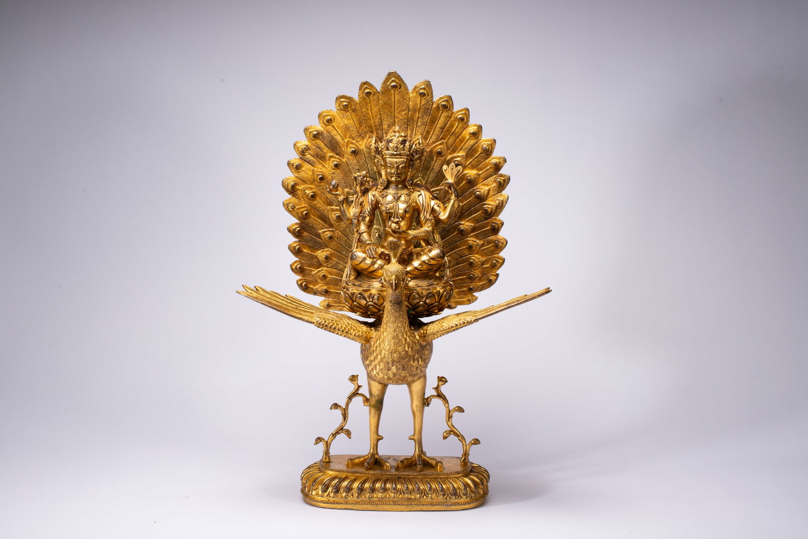 A Solemn Gilt Bronze Statue of Peacock Wisdom King: A Solemn Gilt Bronze Statue of Peacock Wisdom King,Ming Dynasty,China,Yongle Six-character Mark,Size:13.4inx7.9inx18.9in,Weight:11070g 铜鎏金孔雀明王像,