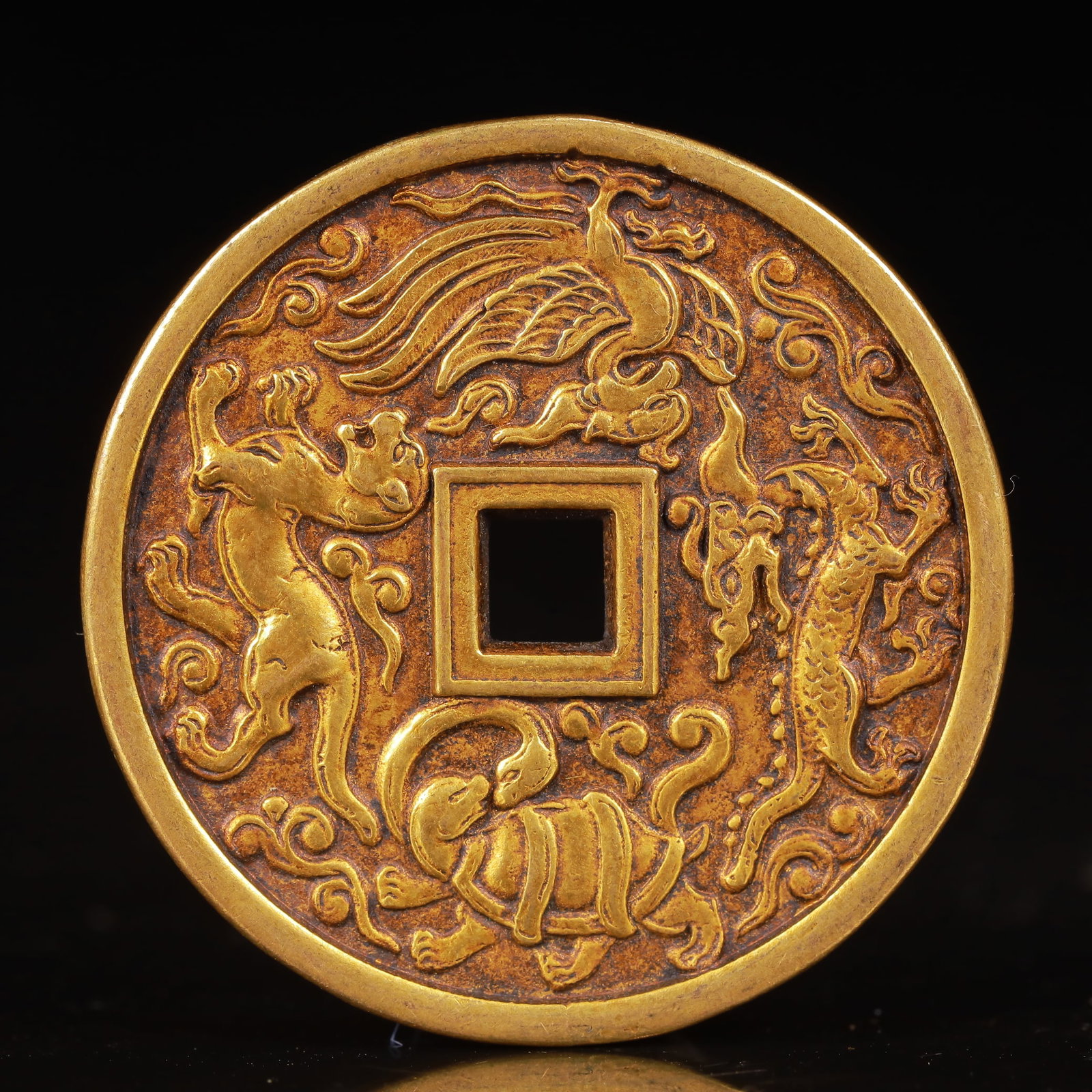 An Exquisite Gilt Bronze Auspicious Beast Pattern Coin: An Exquisite Gilt Bronze Auspicious Beast Pattern Coin,Liao Dynasty,China,Size:1.7inx0.1in,Weight:30g 铜鎏金瑞兽纹钱币,中国辽代