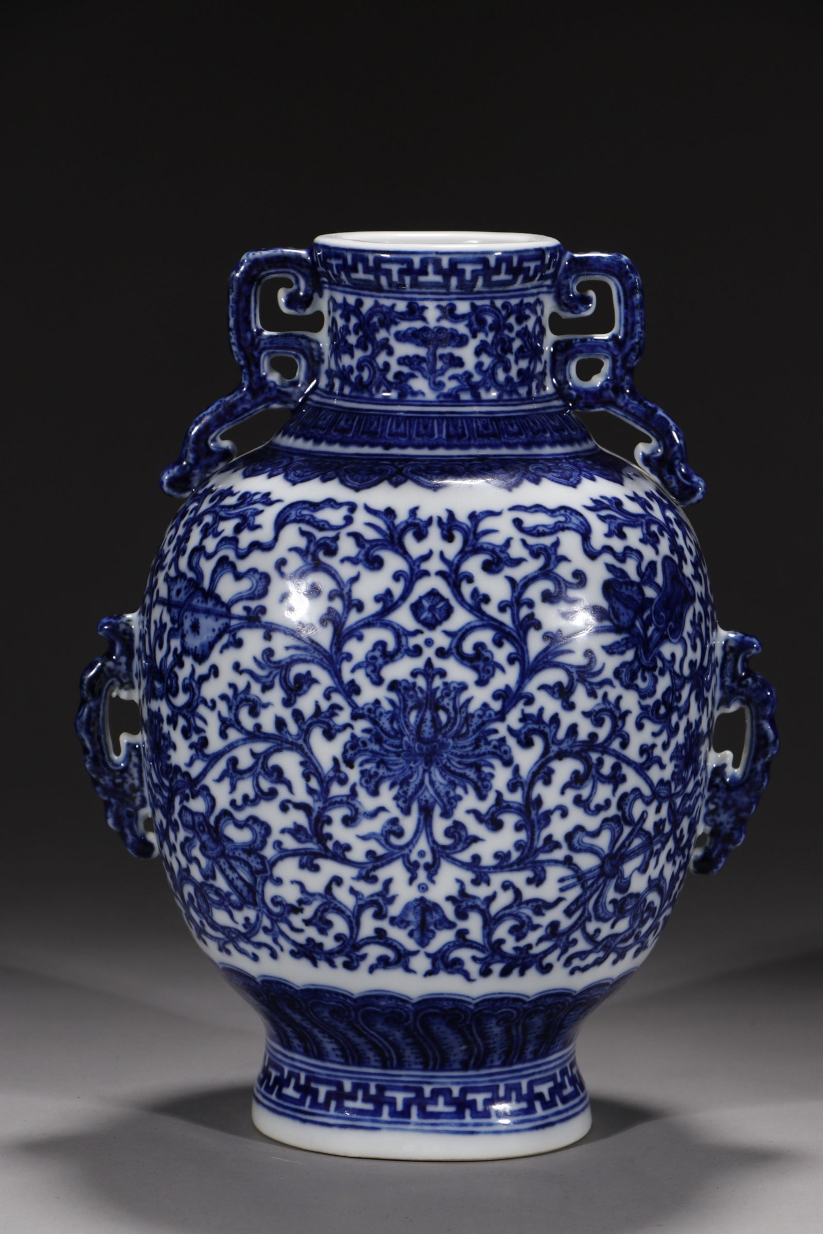 An Exquisite Blue and White Lotus Pattern Double-Ears Vase: An Exquisite Blue and White Lotus Pattern Double-Ears Vase,Qing Dynasty,China,Qianlong Six-character Mark,Size:9.5in 青花缠枝莲纹双耳瓶中