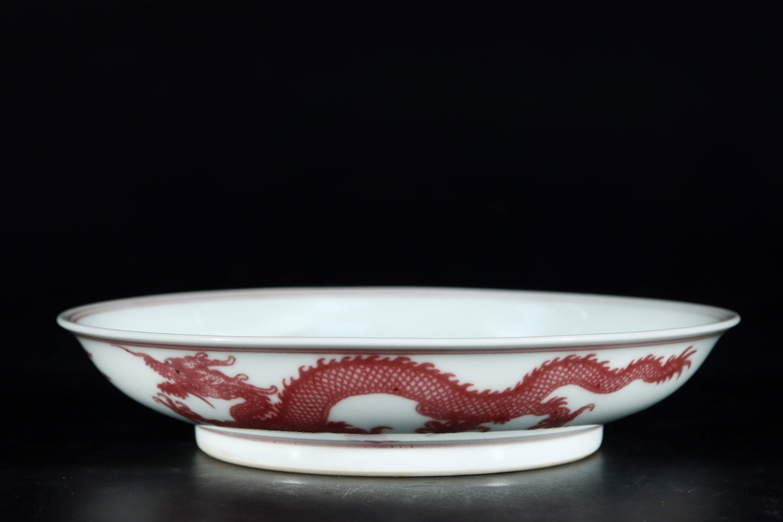 An Exquisite Underglaze-Red Auspicious Cloud and Dragon Pattern Plate: An Exquisite Underglaze-Red Auspicious Cloud and Dragon Pattern Plate,Qing Dynasty,China,Yongzheng Six-character Mark,Size:1.4inx6.8in 釉里红祥云龙纹盘,
