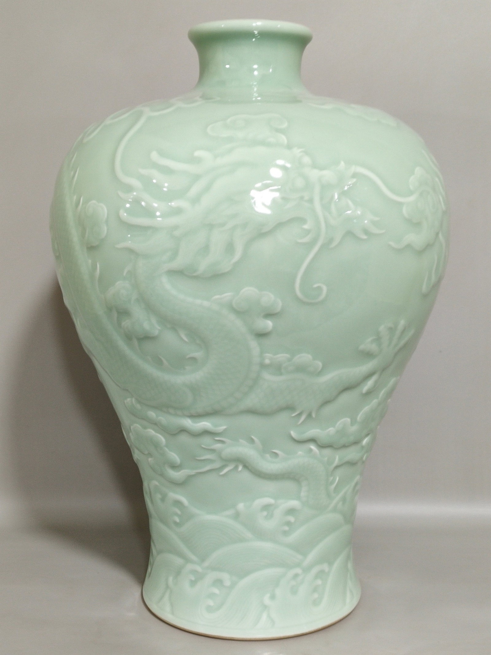 A Rare Celadon Glazed Auspicious Cloud and Dragon Pattern Vase: A Rare Celadon Glazed Auspicious Cloud and Dragon Pattern Vase,Qing Dynasty,China,Qianlong Six-character Mark,Size:14.6inx8.9in 粉青釉祥云龙纹瓶,中