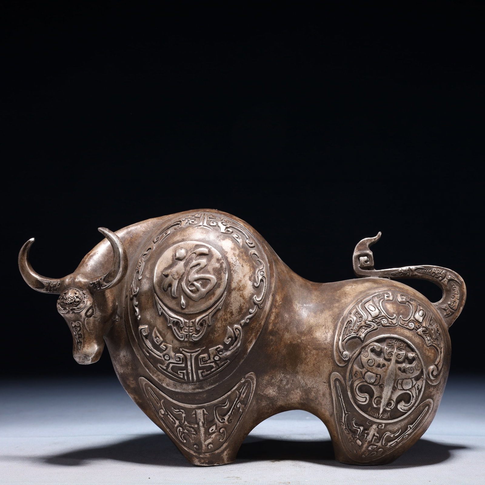 An Exquisite Silver-plated Bronze Beast-Face Pattern Buffalo Ornament: An Exquisite Silver-plated Bronze Beast-Face Pattern Buffalo Ornament,Qing Dynasty,China,Size:9.8inx3.1inx6.3in,Weight:1750g