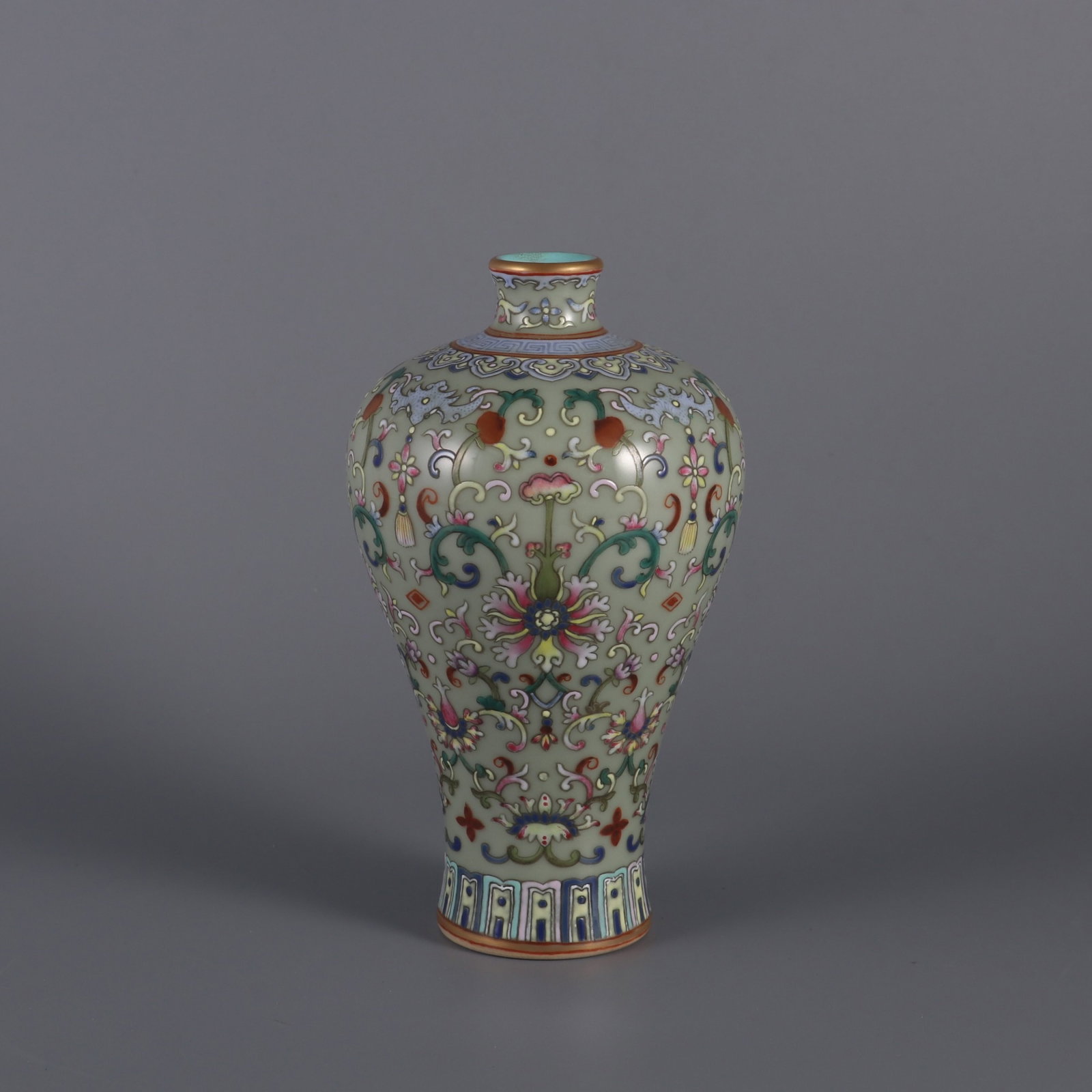 An Exquisite Celadon Glazed Famille-Rose Flower Pattern Vase: An Exquisite Celadon Glazed Famille-Rose Flower Pattern Vase,Qing Dynasty,China,Qianlong Six-character Mark,Size:6.3inx3.3in 青釉粉彩花卉纹瓶,中&#