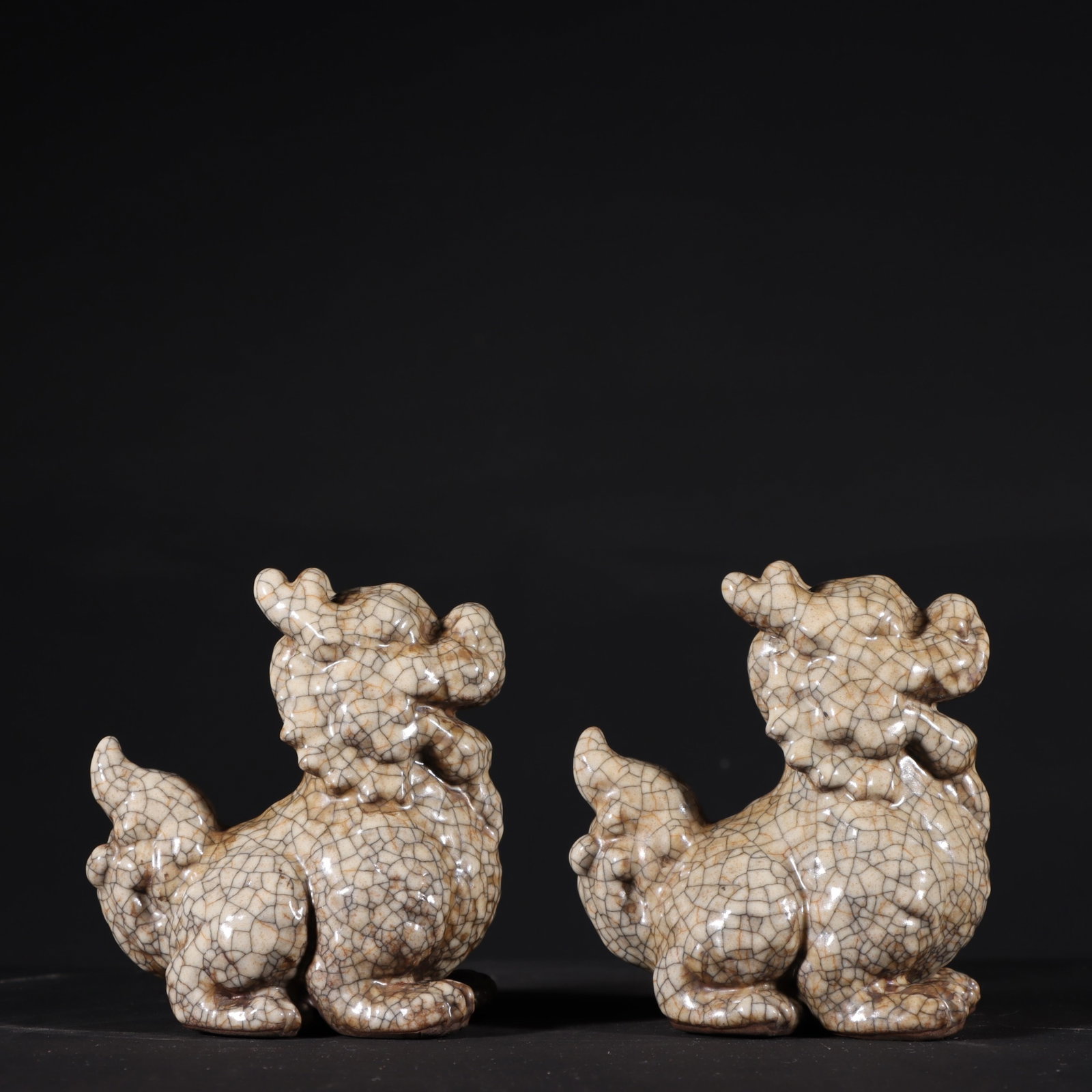 A Pair of Exquisite Ge yao Yellow Glazed Kylin Ornaments: A Pair of Exquisite Ge yao Yellow Glazed Kylin Ornaments,Song Dynasty,China,Size:4.1inx3.9in 一对哥窑黄釉麒麟摆件,中国宋&#