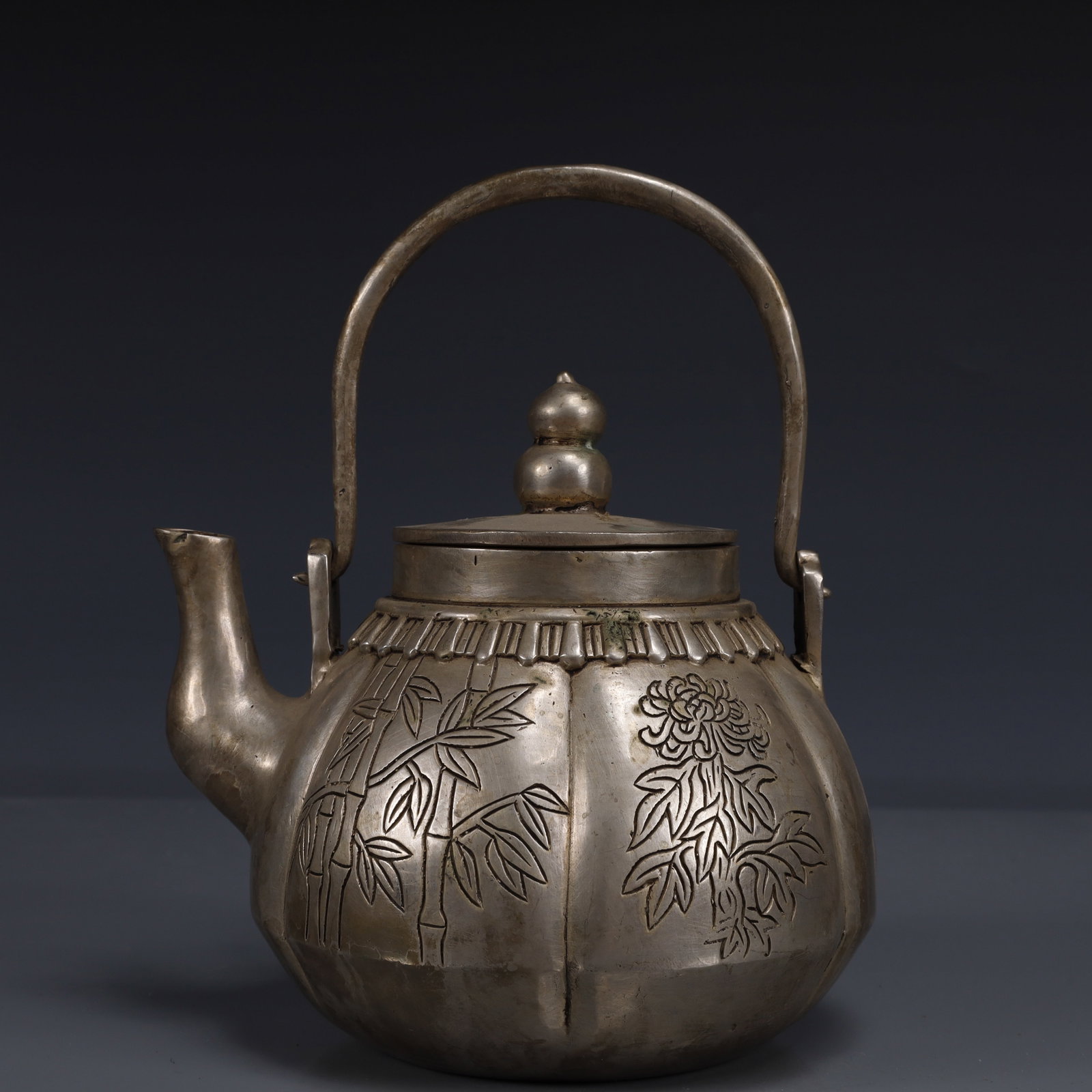 An Exquisite Silver-Plated Bronze Plum Blossom,Orchid Bamboo and Chrysanthemum Pattern Ewer: An Exquisite Silver-Plated Bronze Plum Blossom,Orchid Bamboo and Chrysanthemum Pattern Ewer,Qing Dynasty, China,Qianlong Four-character Mark,Size:5.9inx5.1inx7.9in,Weight:900g 铜镀银