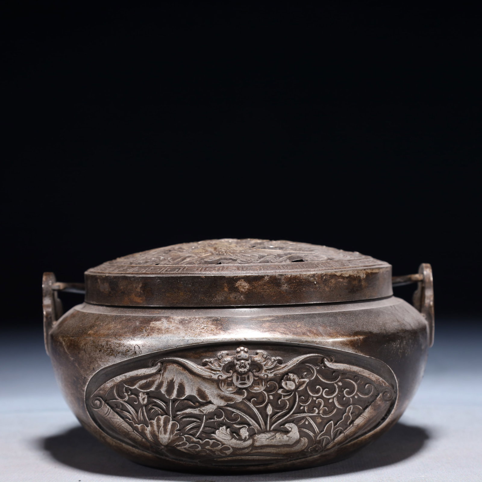 An Exquisite Silver-plated Bronze Flower and Mandarin Duck Pattern Double-Ears Jar with Cover: An Exquisite Silver-plated Bronze Flower and Mandarin Duck Pattern Double-Ears Jar with Cover,Qing Dynasty,China,With Mark,Size:5.9inx5.5inx5.1in,Weight:1050g 铜镀银花卉&