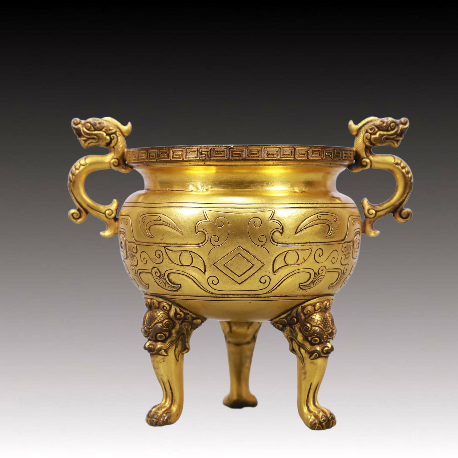 An Exquisite Gilt Bronze Double-Ears and Tripod Censer: An Exquisite Gilt Bronze Double-Ears and Tripod Censer ,Qing Dynasty, China,Qianlong Four-character Mark,Size:6.7inx4.3inx5.5in Weight:750g
