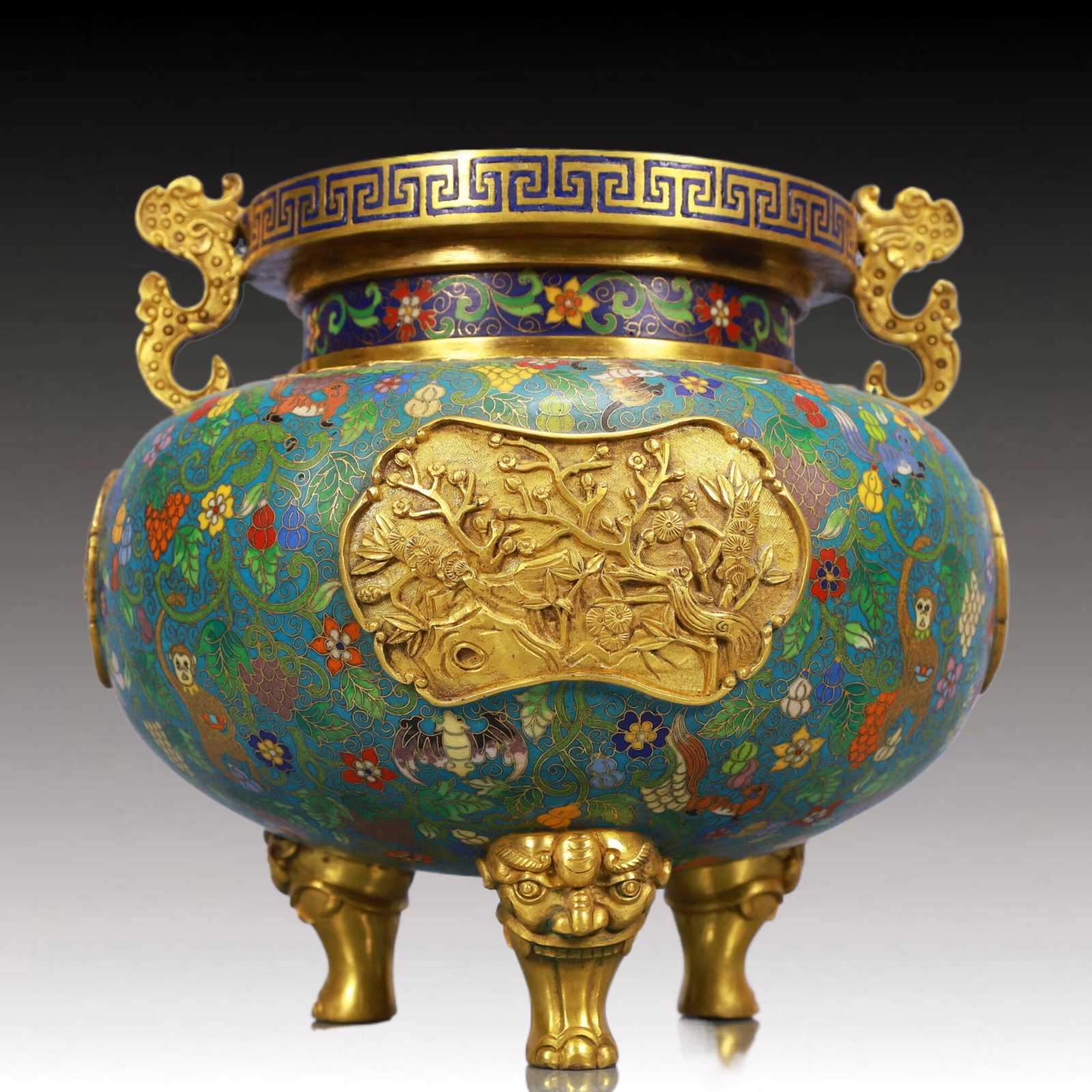 An Exquisite Cloisonne Flower and Animal Pattern Dragon-Ears Tripod Censer: An Exquisite Cloisonne Flower and Animal Pattern Dragon-Ears Tripod Censer, Qing Dynasty, China, Qianlong Four-character Mark, Size:9.8inx9.1in, Weight:8350g 景泰蓝花卉&#