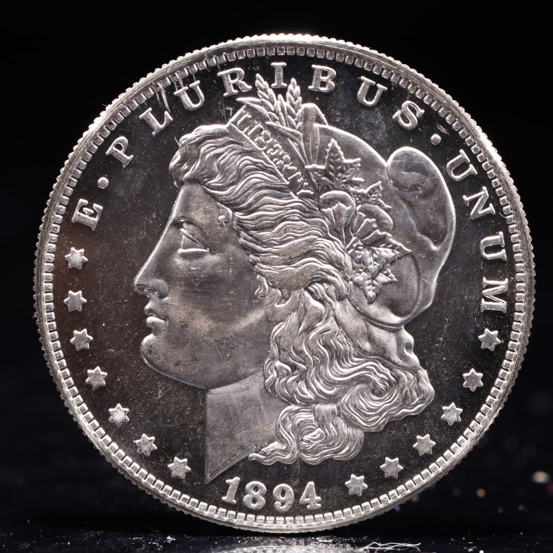 USA Morgan Dollar 1894 Coin: Obv: profile bust with date below and E PLURIBUS UNUM legend and stars around. Rev: eagle with In God we trust above within wreath with UNITED STATES OF AMERICA ONE DOLLAR legend. IN GOD WE TRUST / LI