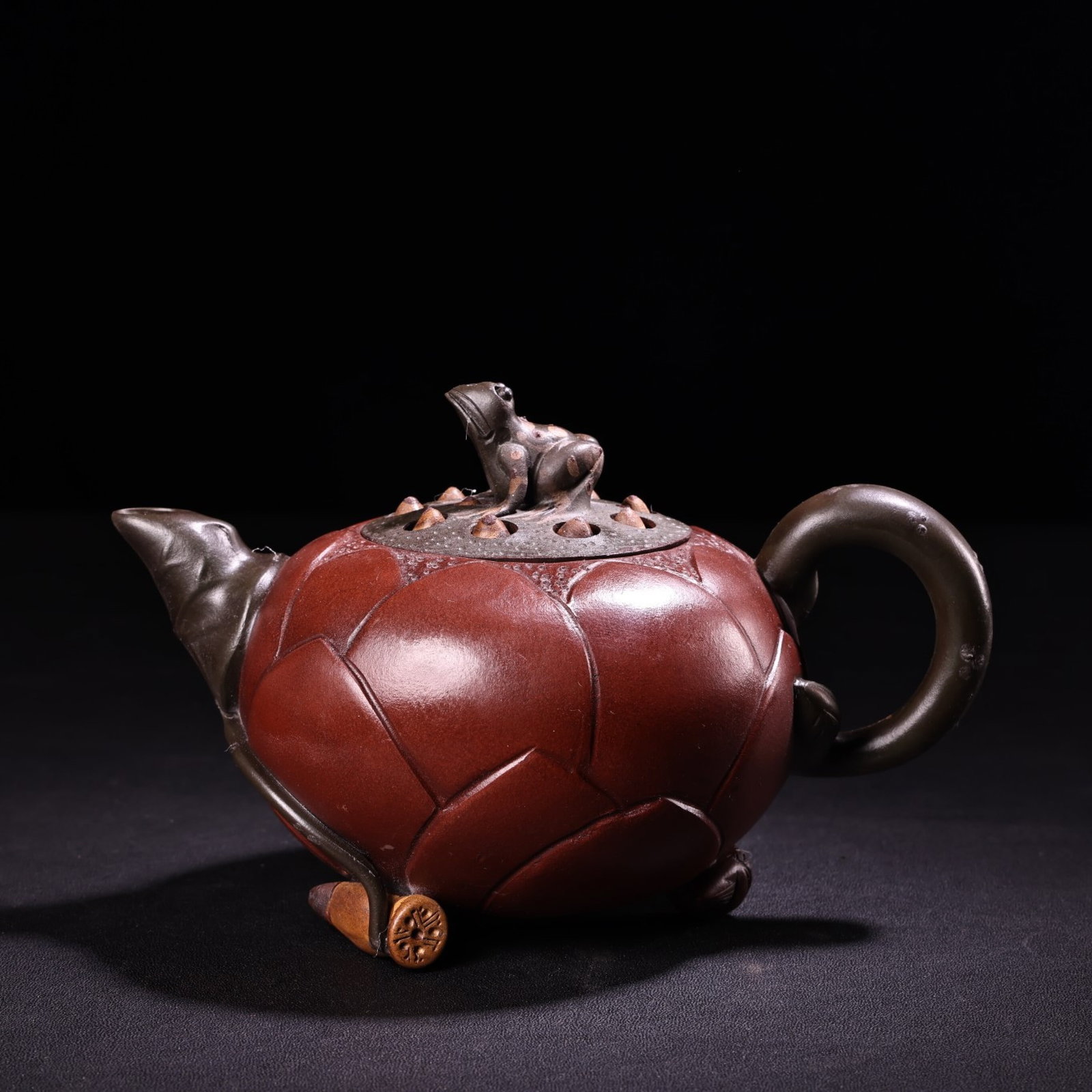 An Exquisite Purple Sands Lotus and Frog Pattern Pot: An Exquisite Purple Sands Lotus and Frog Pattern Pot,Qing Dynasty,China,With Mark,Size:4.3inx6.7in,Weight:380g 紫砂莲花蛙壶,中国清代,带