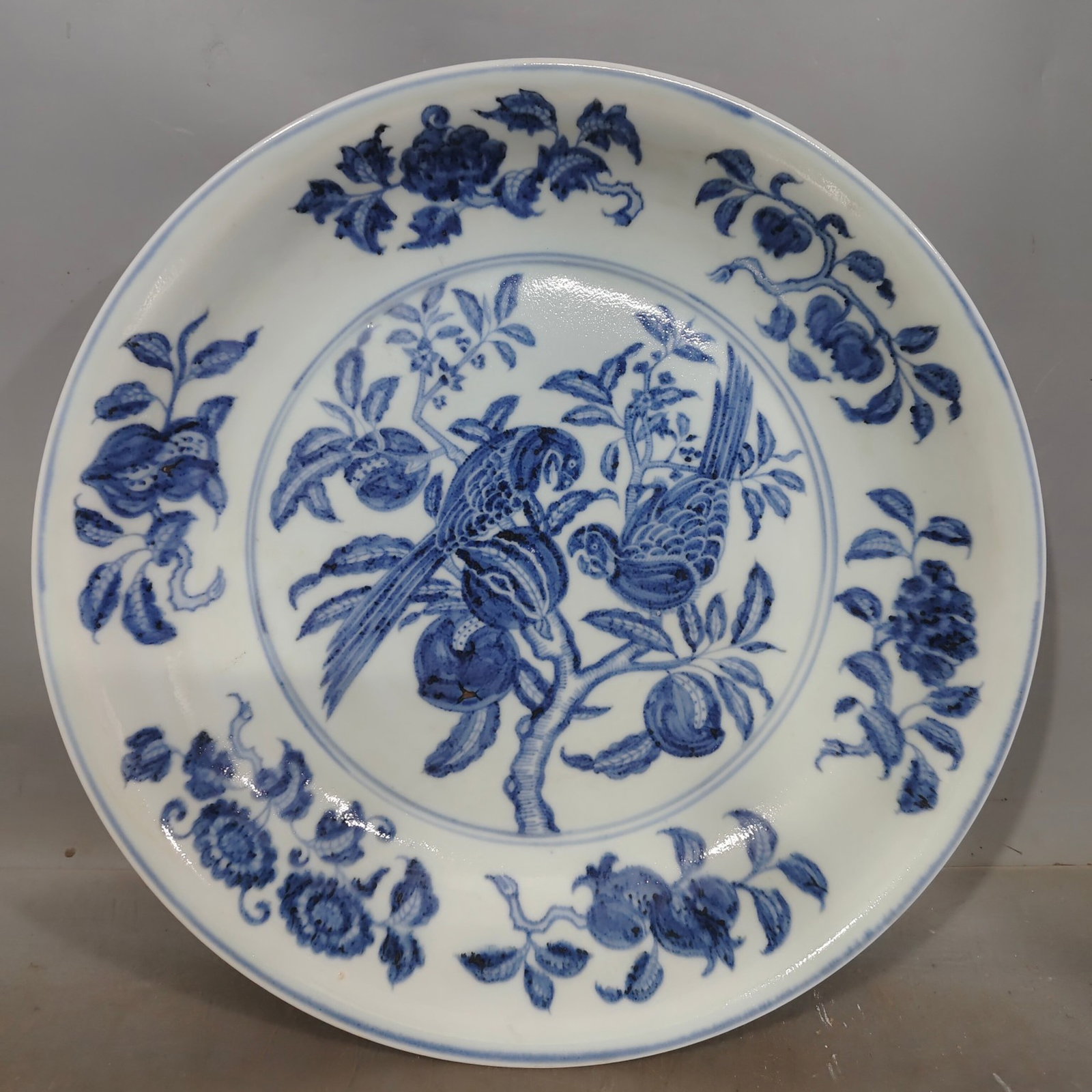 A Rare Blue and White Flower and Bird Pattern Plate: A Rare Blue and White Flower and Bird Pattern Plate,Ming Dynasty,China,Xuande Six-character Mark,Size:15.6inx2.6in 青花花鸟纹盘,中国明代,