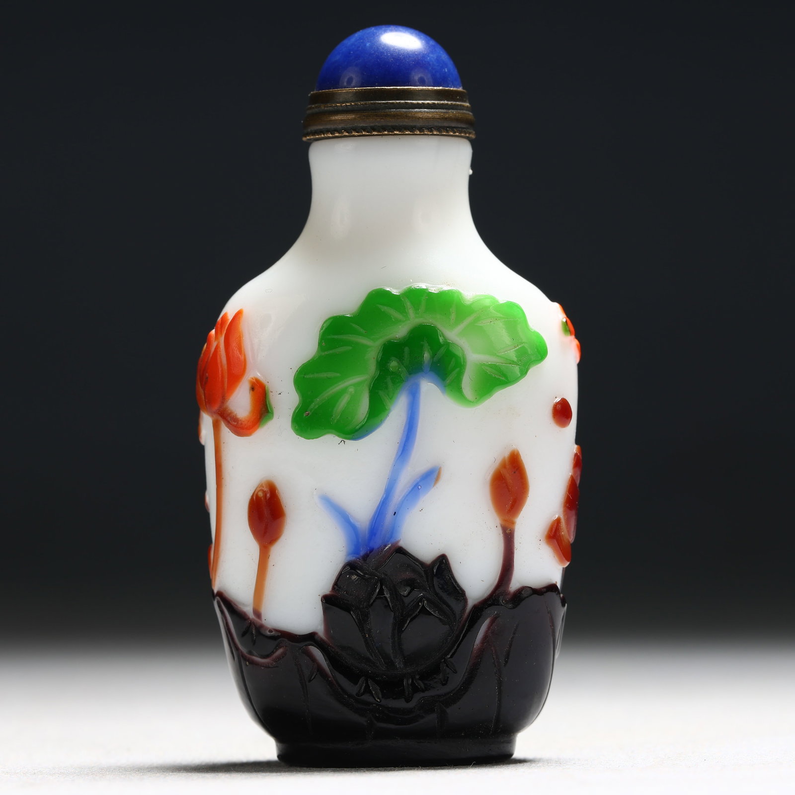 An Exquisite Glass Multi-Color Overlay Lotus and Fish Pattern Snuff Bottle: An Exquisite Glass Multi-Color Overlay Lotus and Fish Pattern Snuff Bottle,Qing Dynasty, China,Tongzhi Four-character Mark,Size:1.4inx0.7inx2.8in 琉璃套彩莲花ྦ