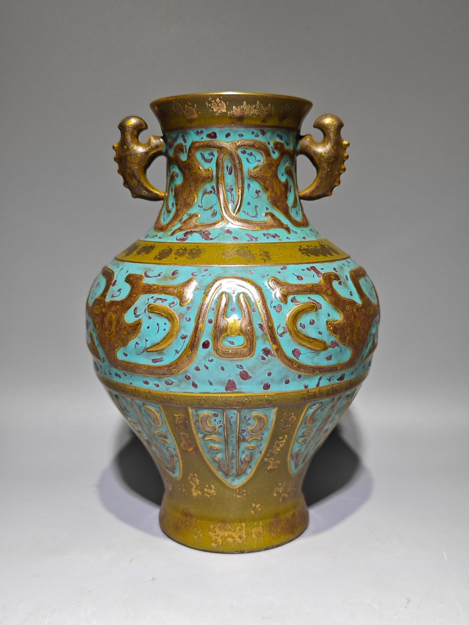 An Exquisite Ancient Bronze Glazed Painted Gold Dragon Pattern Double-Ears Vase: An Exquisite Ancient Bronze Glazed Painted Gold Dragon Pattern Double-Ears Vase,Qing Dynasty,China,Qianlong Six-character Mark,Size:9.1inx6.3in 古铜釉描金龙纹