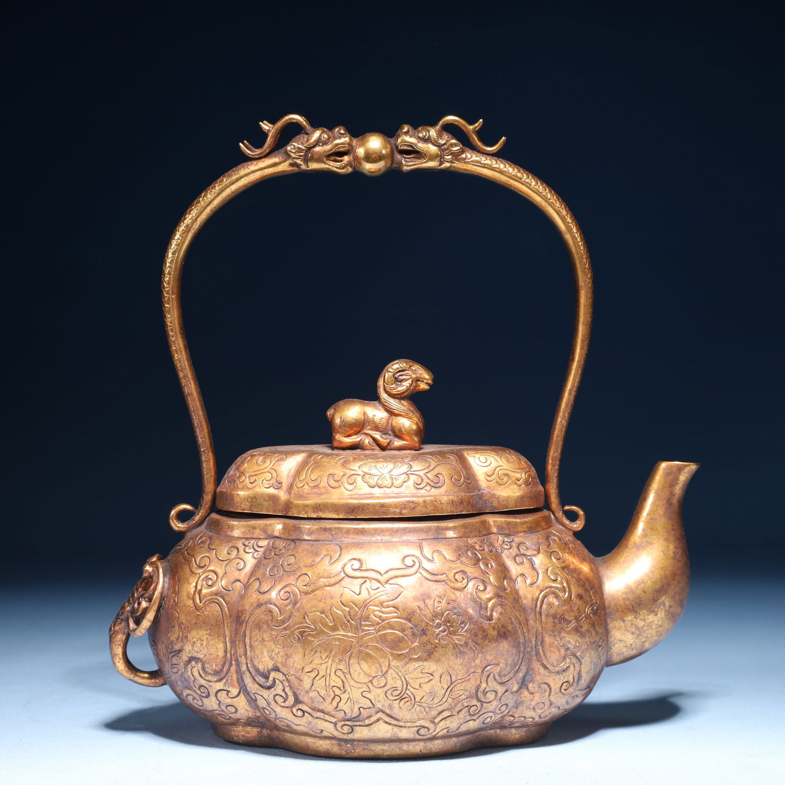 An Exquisite Gilt Bronze Flower and Butterfly Pattern Loop-Handled Pot: An Exquisite Gilt Bronze Flower and Butterfly Pattern Loop-Handled Pot,Qing Dynasty,China,Size:7.1inx3.5inx7.5in,Weight:550g 铜鎏金花卉蝴蝶纹提