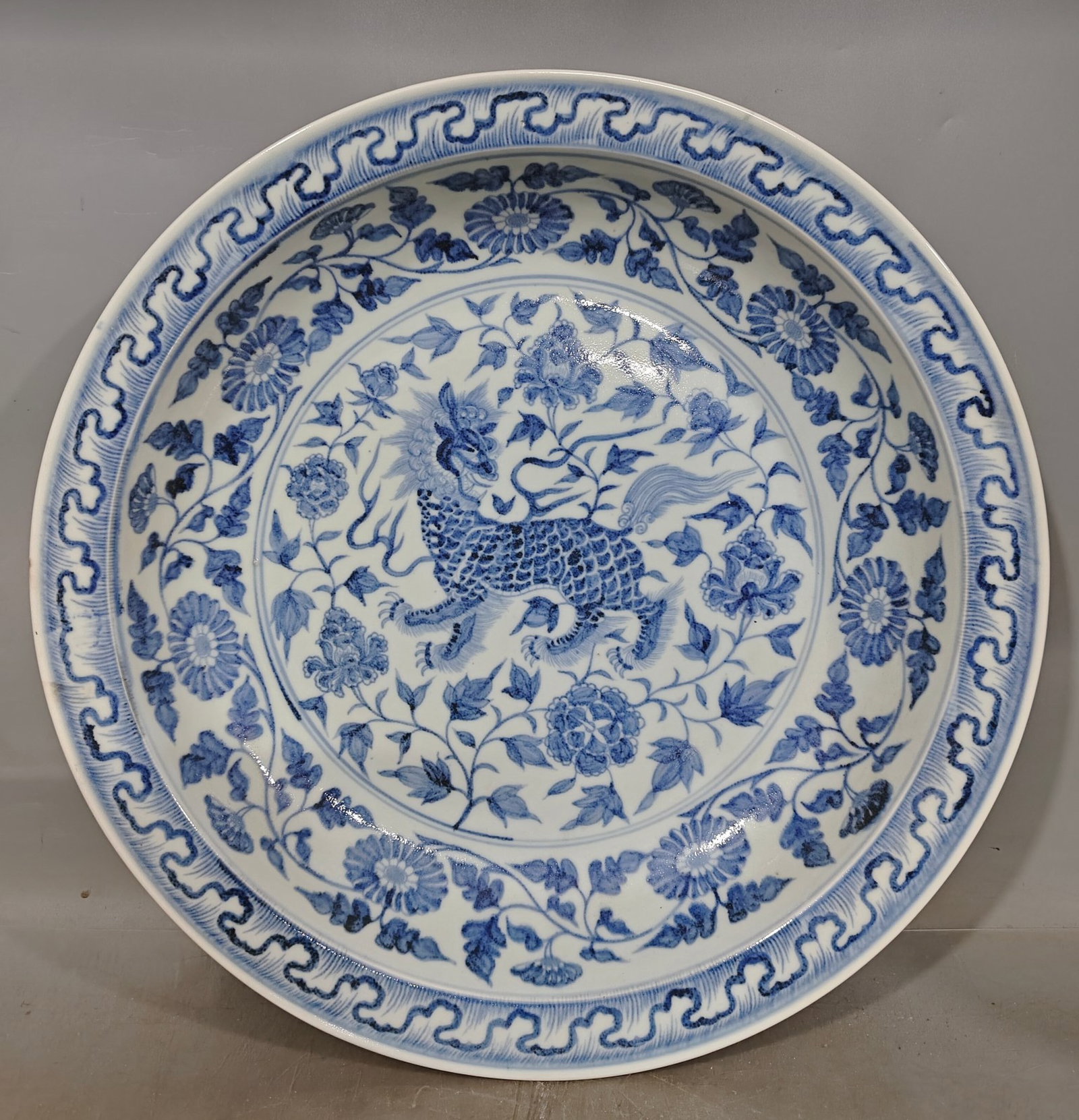 A Huge Blue and White Lotus and Kylin Pattern Plate: A Huge Blue and White Lotus and Kylin Pattern Plate,Qing Dynasty,China,Size:18.1inx2.8in 青花缠枝莲麒麟纹盘,中国清代