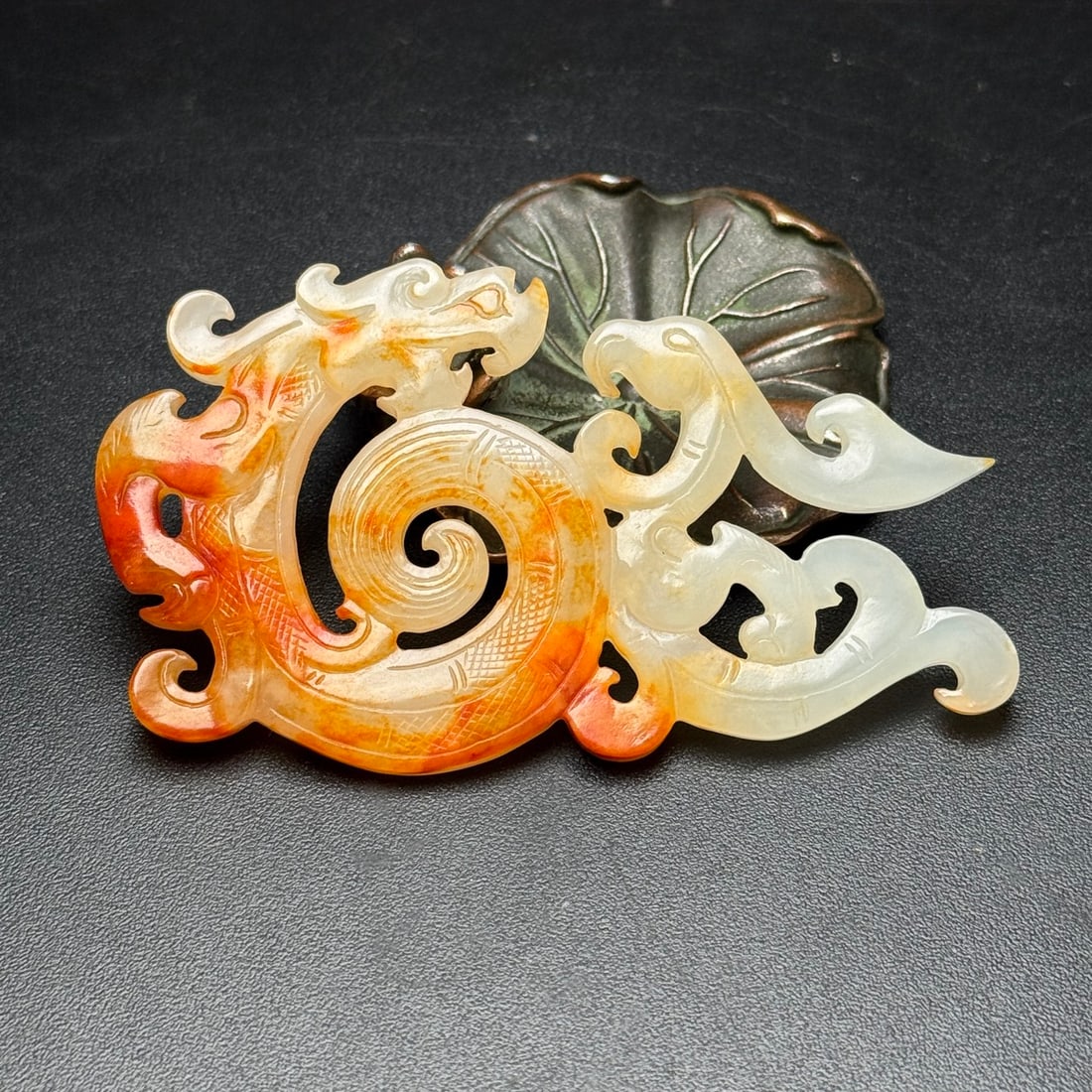 A Exquisite Hotan Jade Dragon Plaque: A Exquisite Hotan Jade Dragon Plaque,Han Dynasty, China,Size:3.2inx1.8inx0.2in,Weight:26g 和田玉龙牌,中国汉代
