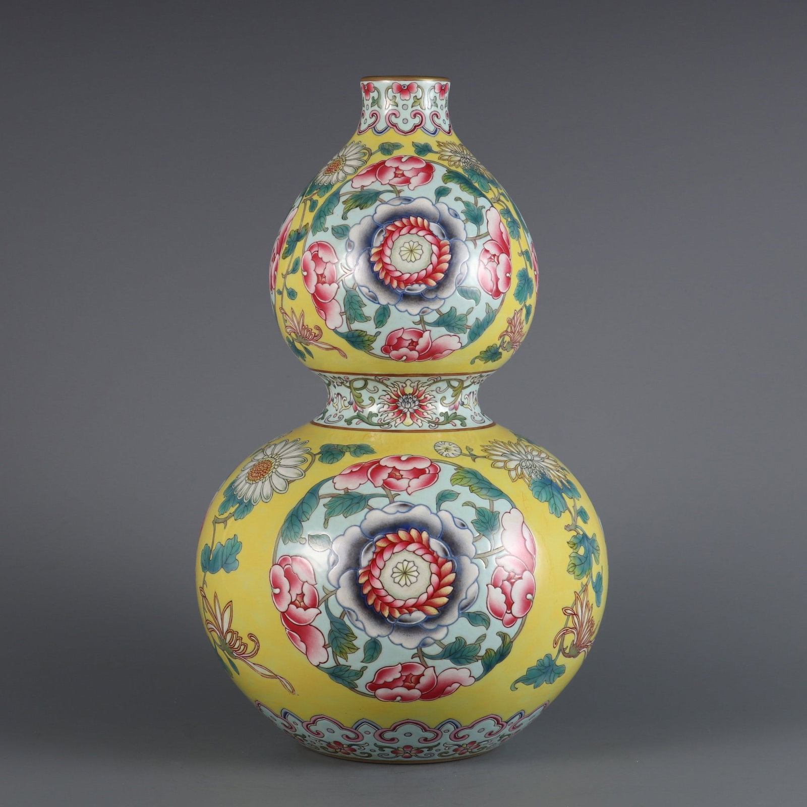 A Exquisite Yellow Ground Foreign Color Flower Pattern Vase: A Exquisite Yellow Ground Foreign Color Flower Pattern Vase,Qing Dynasty, China,Qianlong Six-character Mark,Size:12.4inx7.3inx1.6in 黄地洋彩花卉纹瓶,