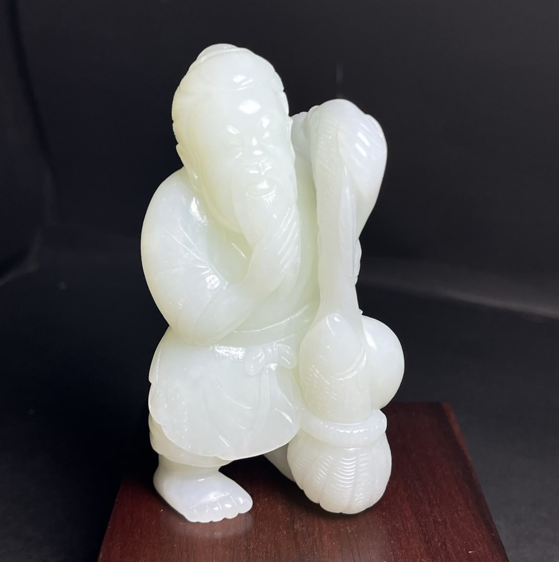 A Exquisite Hotan Jade Figures Handheld Carving: A Exquisite Hotan Jade Figures Handheld Carving,Qing Dynasty, China,Size:3.7inx1.2inx2in,Weight:196g 和田玉人形手把件,中国清代