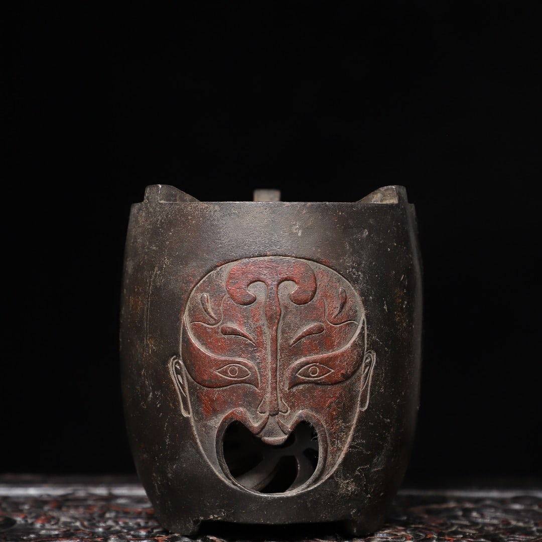 A Exquisite Gold-Foiled Bronze Mask Pattern Censer: A Exquisite Gold-Foiled Bronze Mask Pattern Censer,Qing Dynasty, China,Size:5.5inx4.3inx3.9in,Weight:1400g 铜拓金脸谱纹炉,中国清代