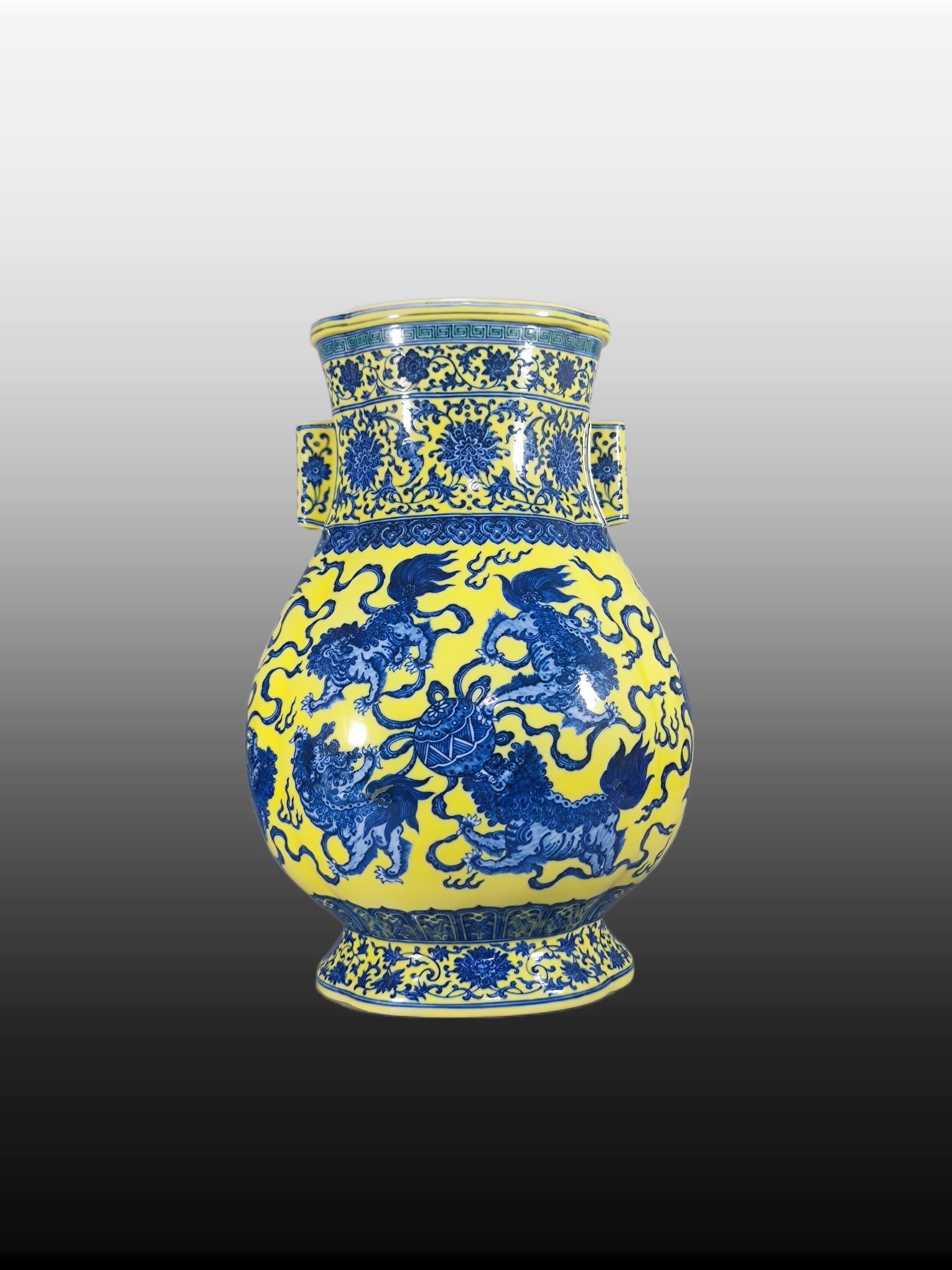 A Exquisite Yellow Ground Blue and White Lion Pattern Vase: A Exquisite Yellow Ground Blue and White Lion Pattern Vase,Qing Dynasty, China,Qianlong Six-character Mark,Size:17.1inx7.8inx11.8inx8.3in 黄地青花狮纹瓶,È